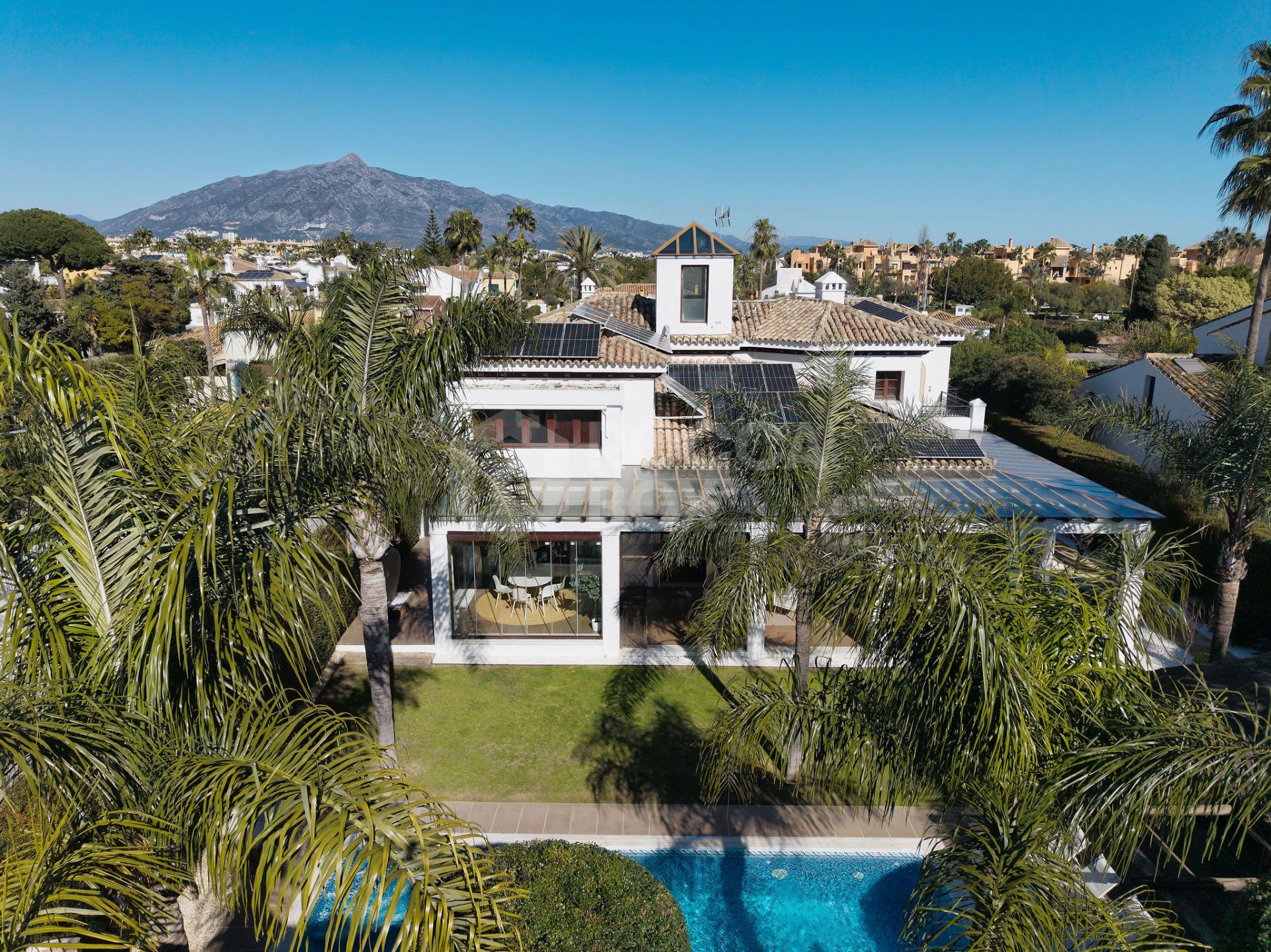 Welcome to this exclusive three-level villa in San Pedro Playa