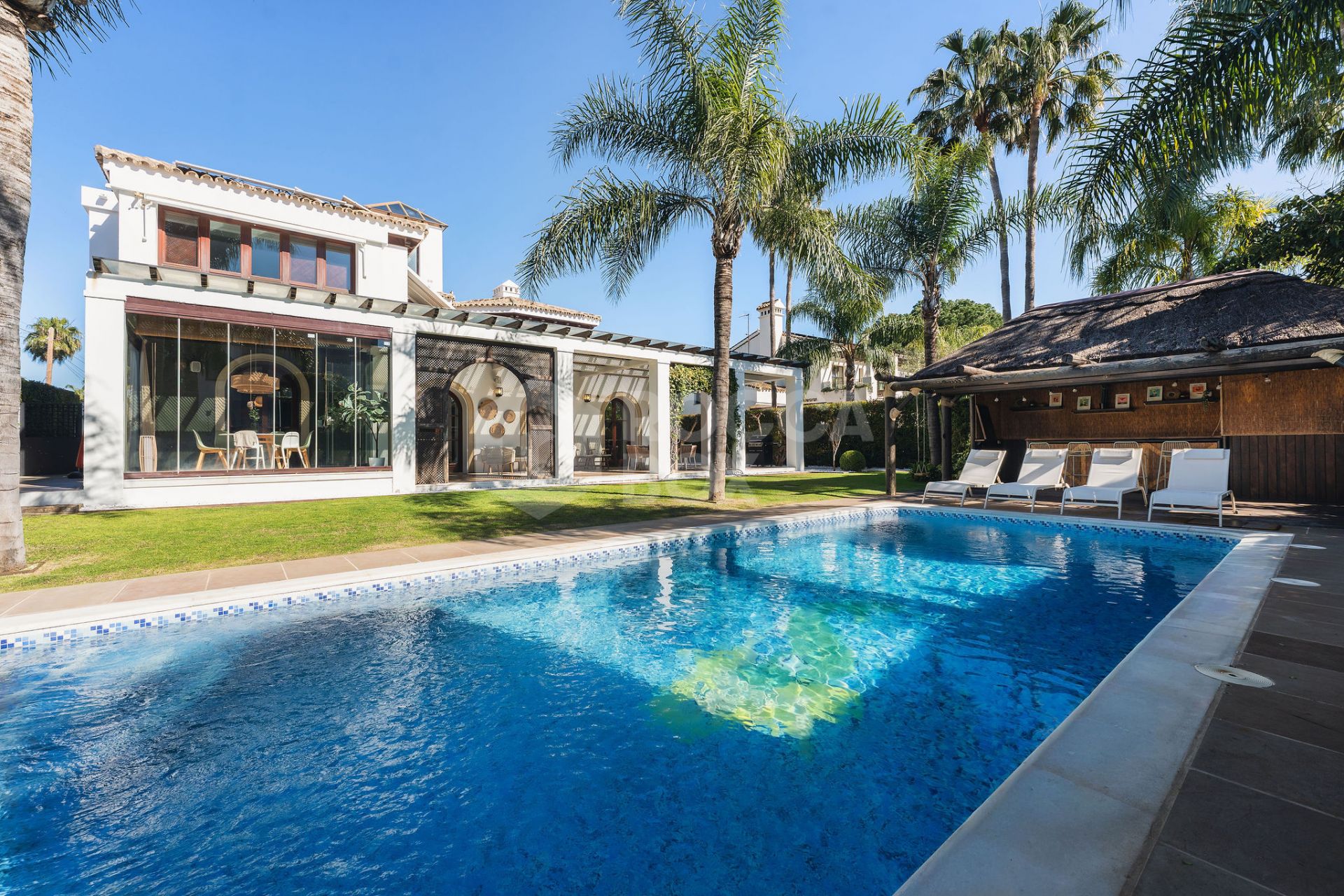 Welcome to this exclusive three-level villa in San Pedro Playa