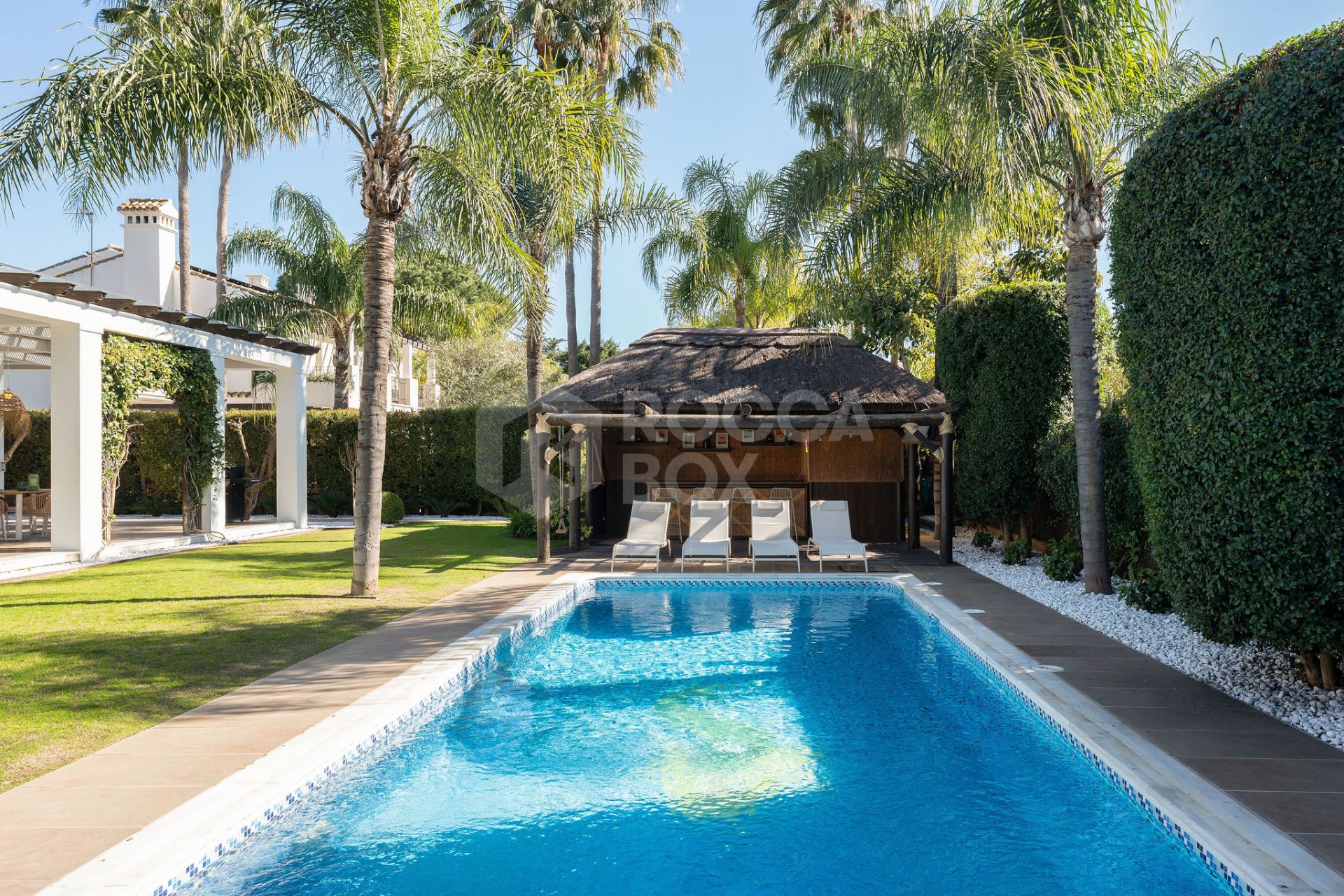 Welcome to this exclusive three-level villa in San Pedro Playa