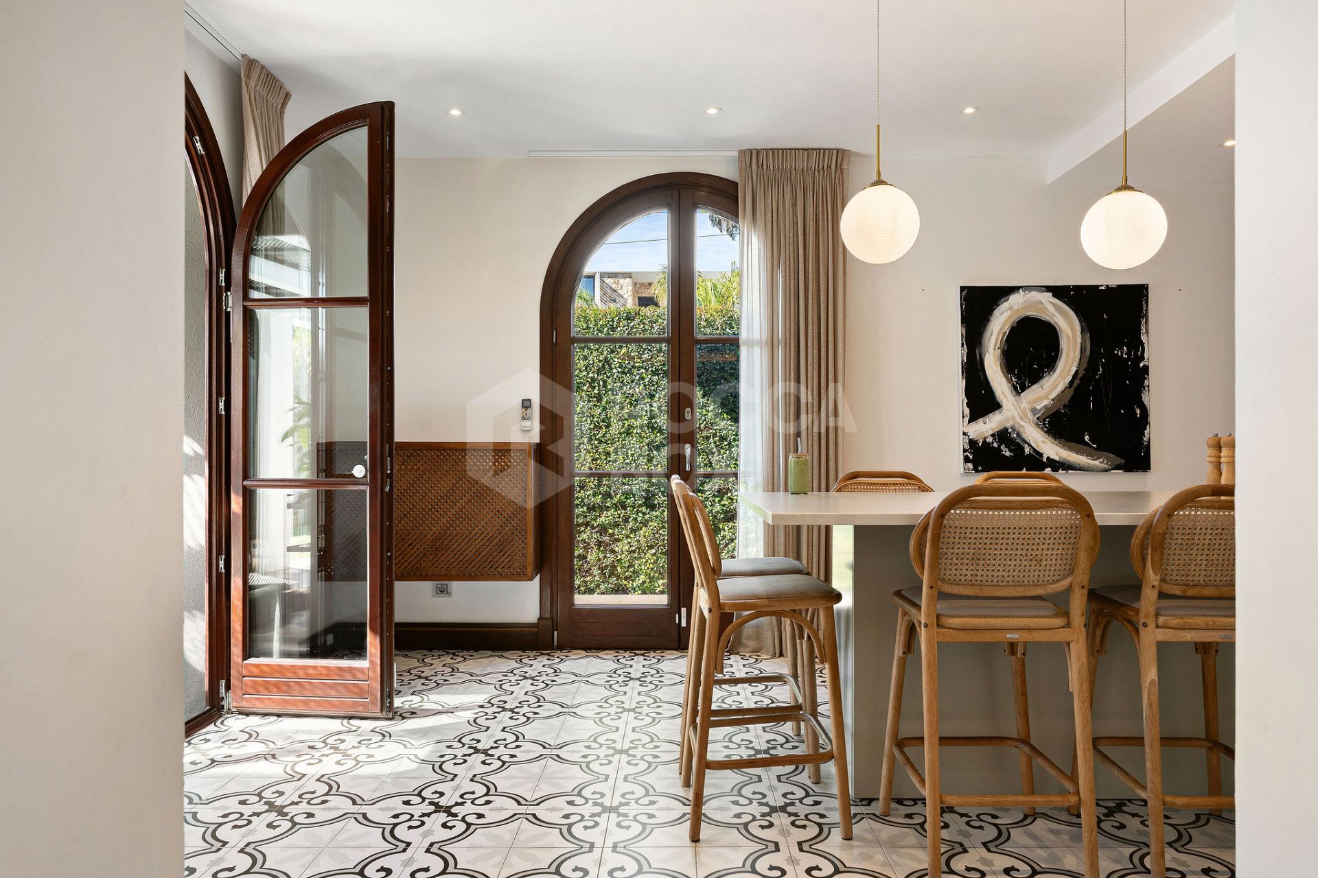 Welcome to this exclusive three-level villa in San Pedro Playa