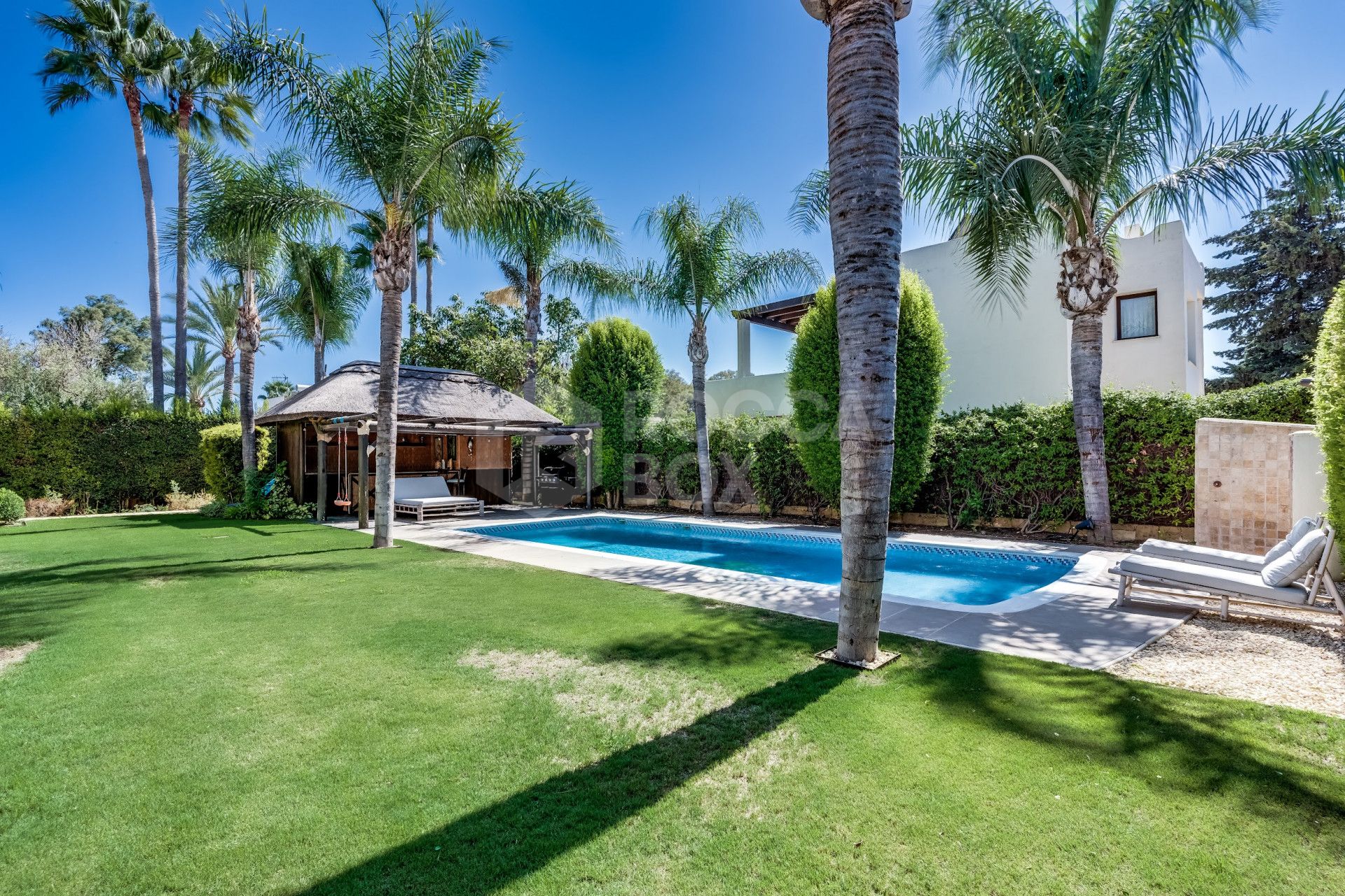 Welcome to this exclusive three-level villa in San Pedro Playa