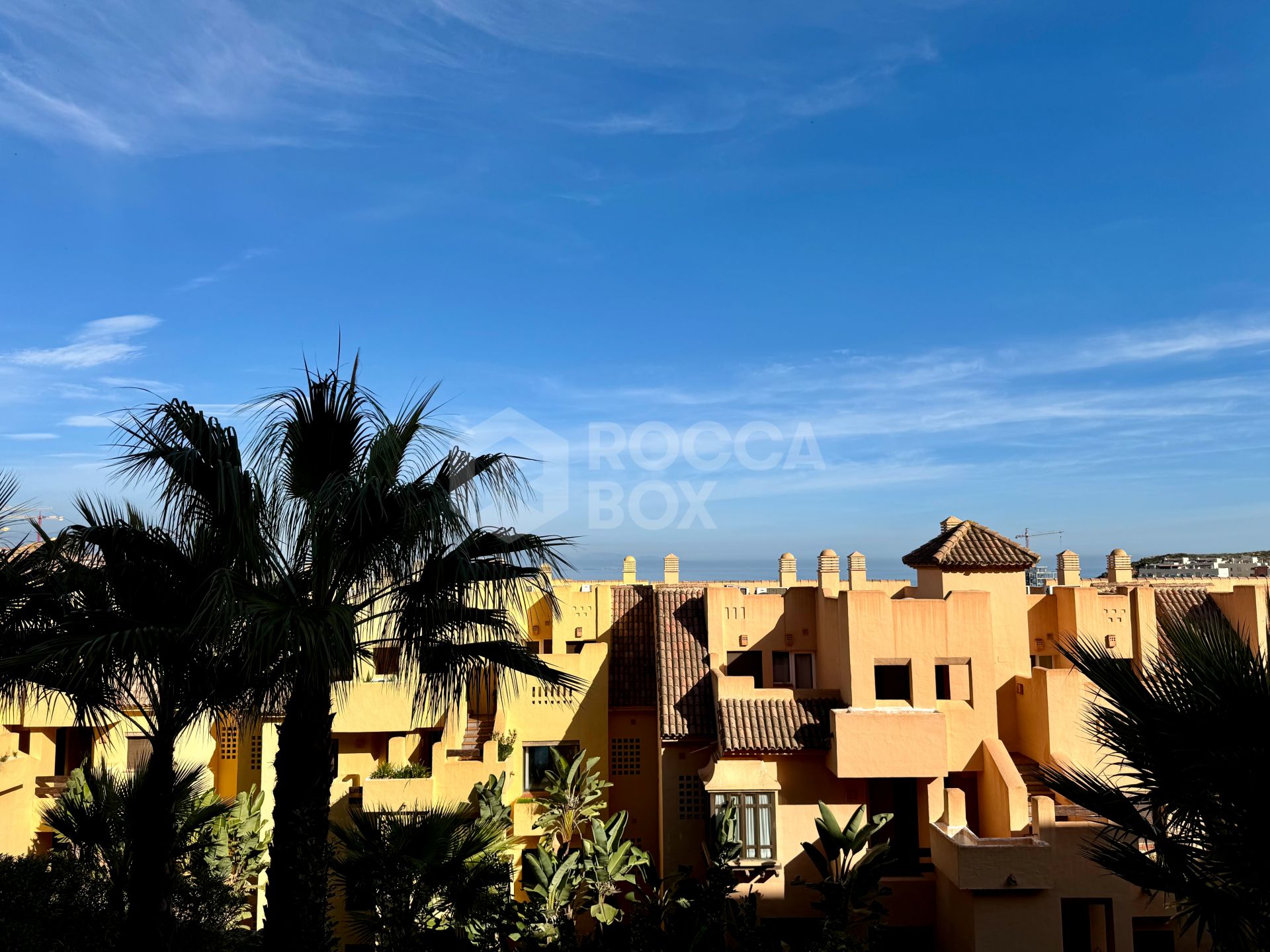 Elevated ground-floor apartment with terrace and open outlook, Manilva