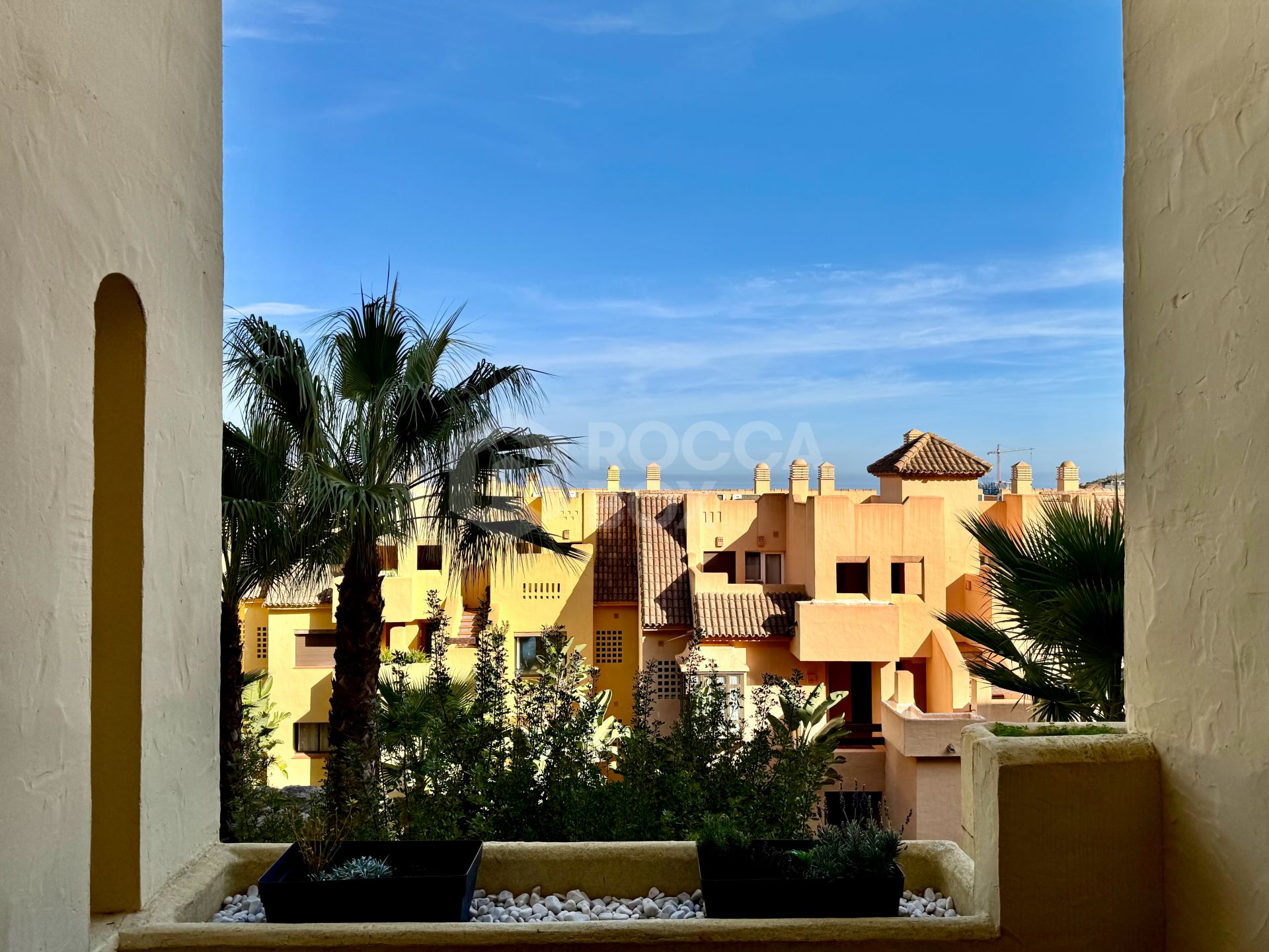 Elevated ground-floor apartment with terrace and open outlook, Manilva