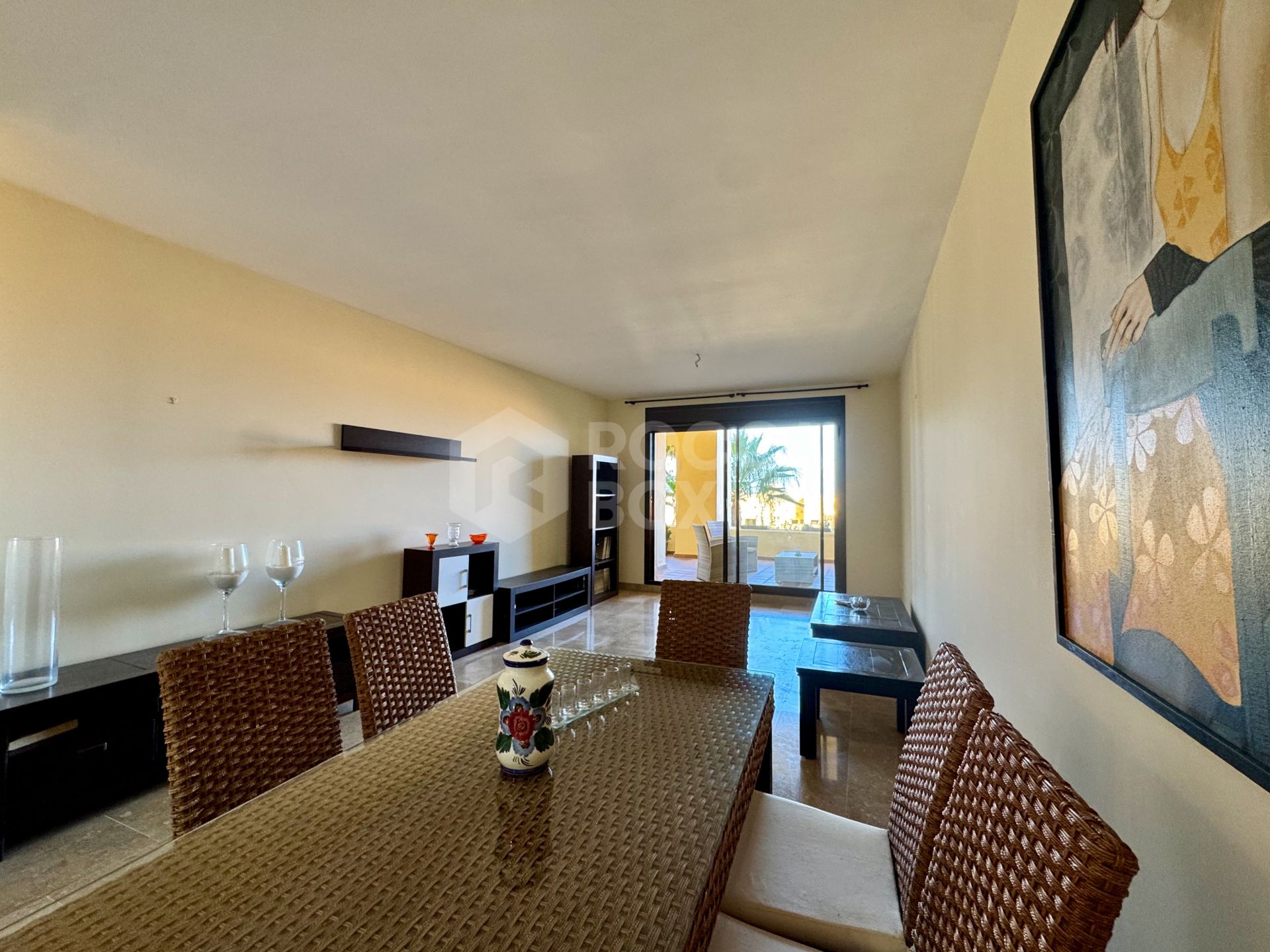 Elevated ground-floor apartment with terrace and open outlook, Manilva