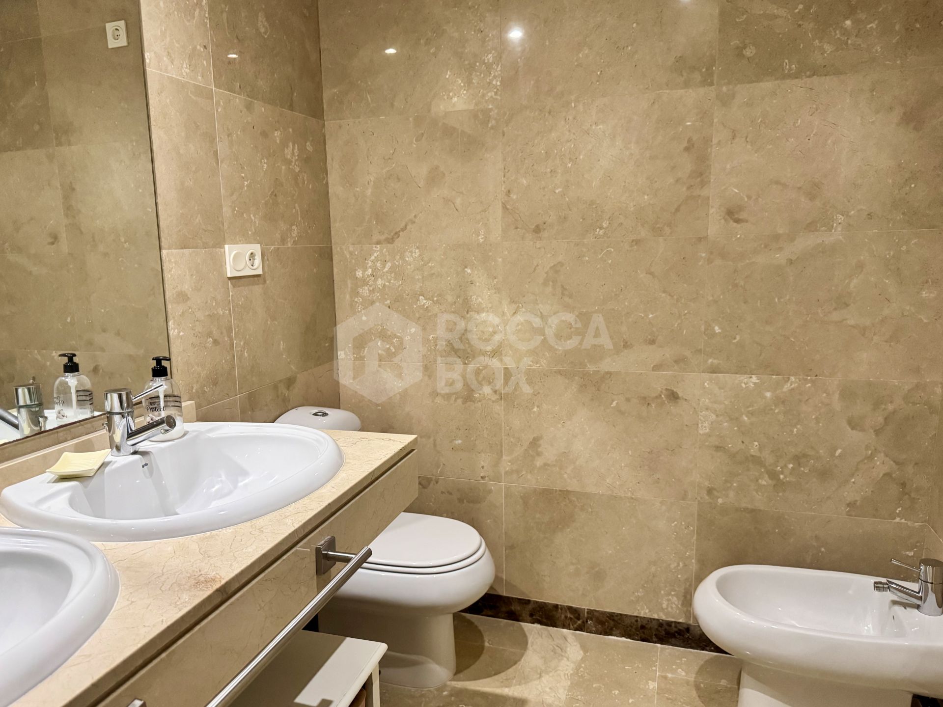 Elevated ground-floor apartment with terrace and open outlook, Manilva