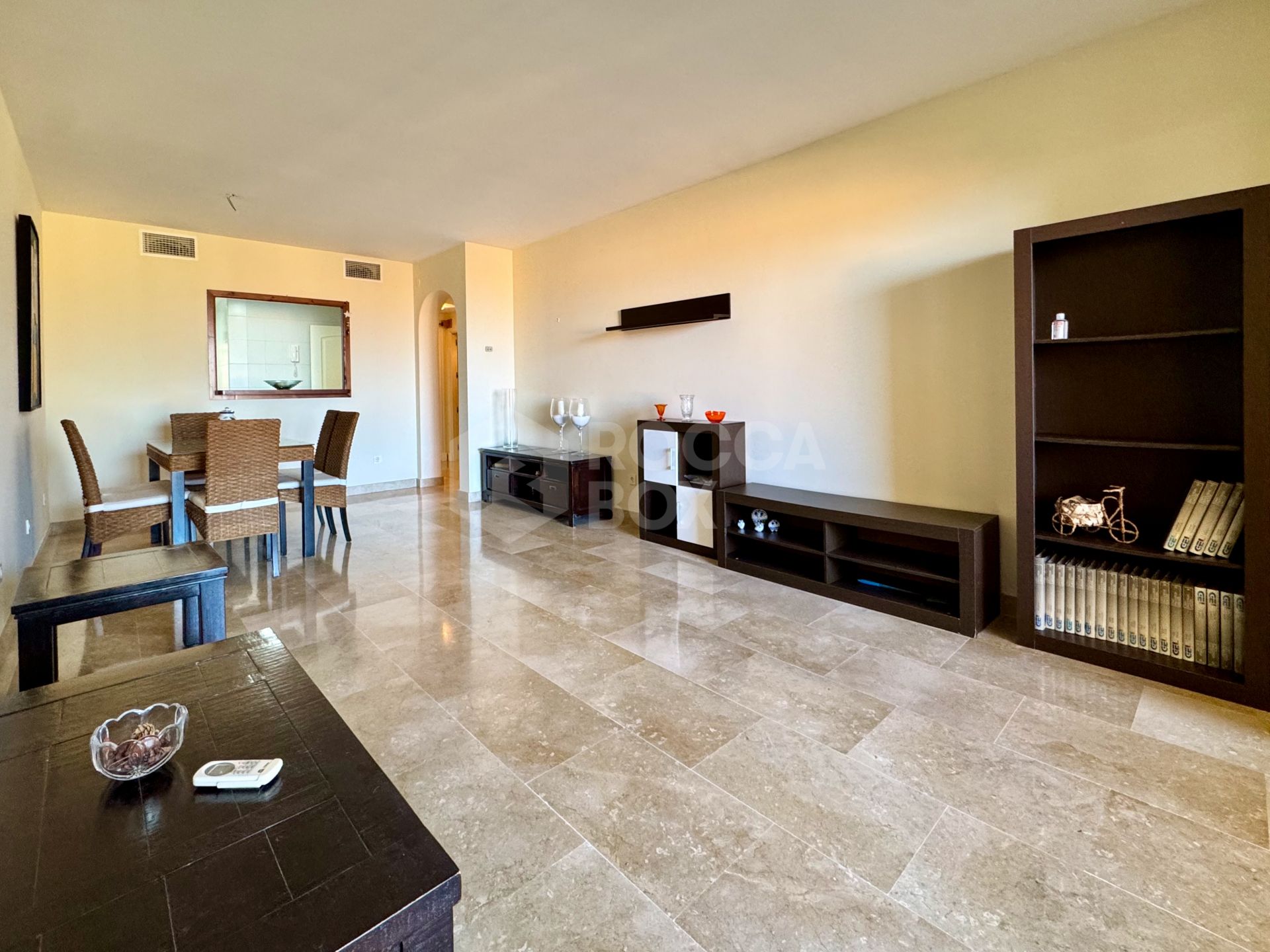 Elevated ground-floor apartment with terrace and open outlook, Manilva