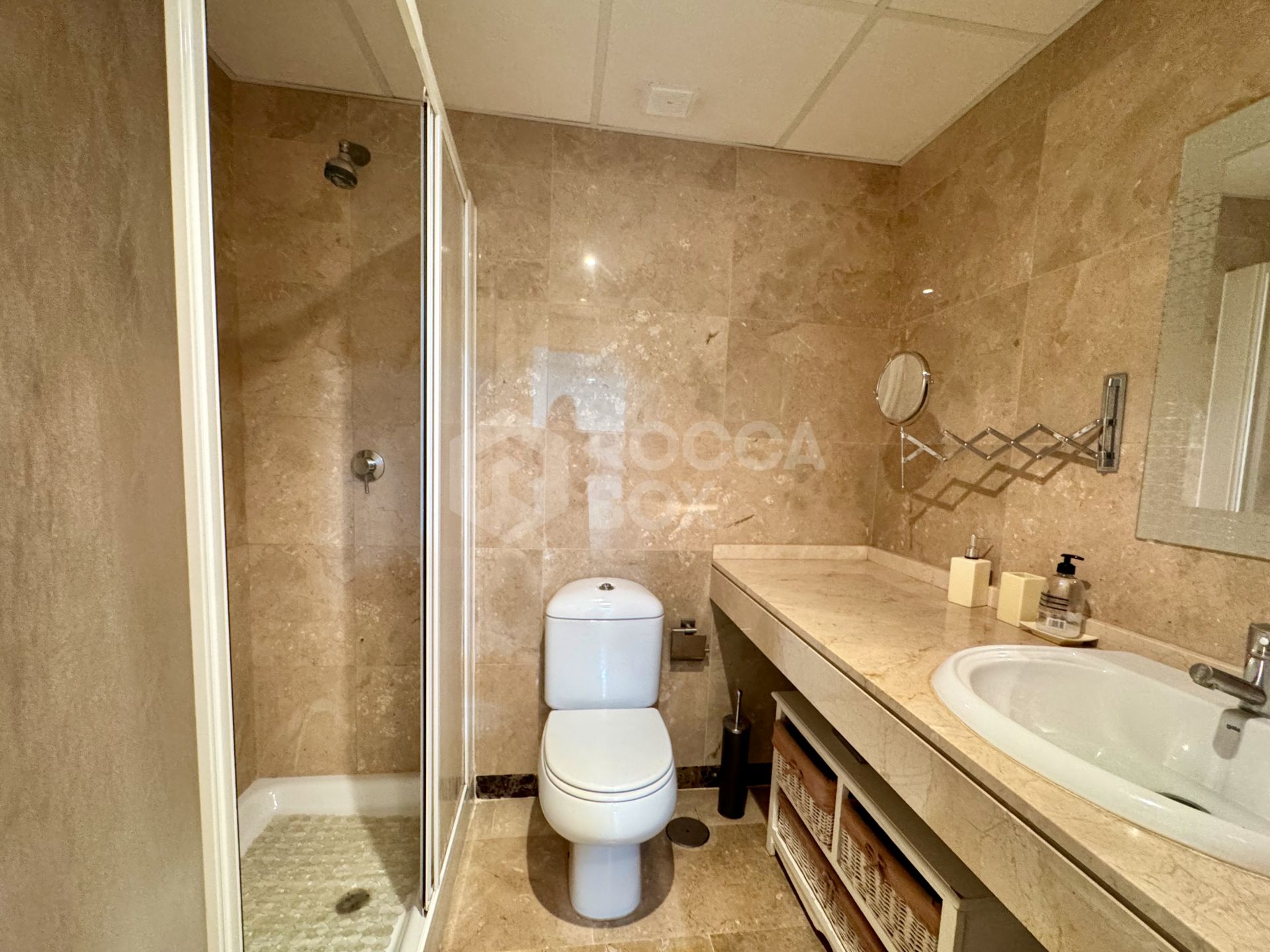 Elevated ground-floor apartment with terrace and open outlook, Manilva