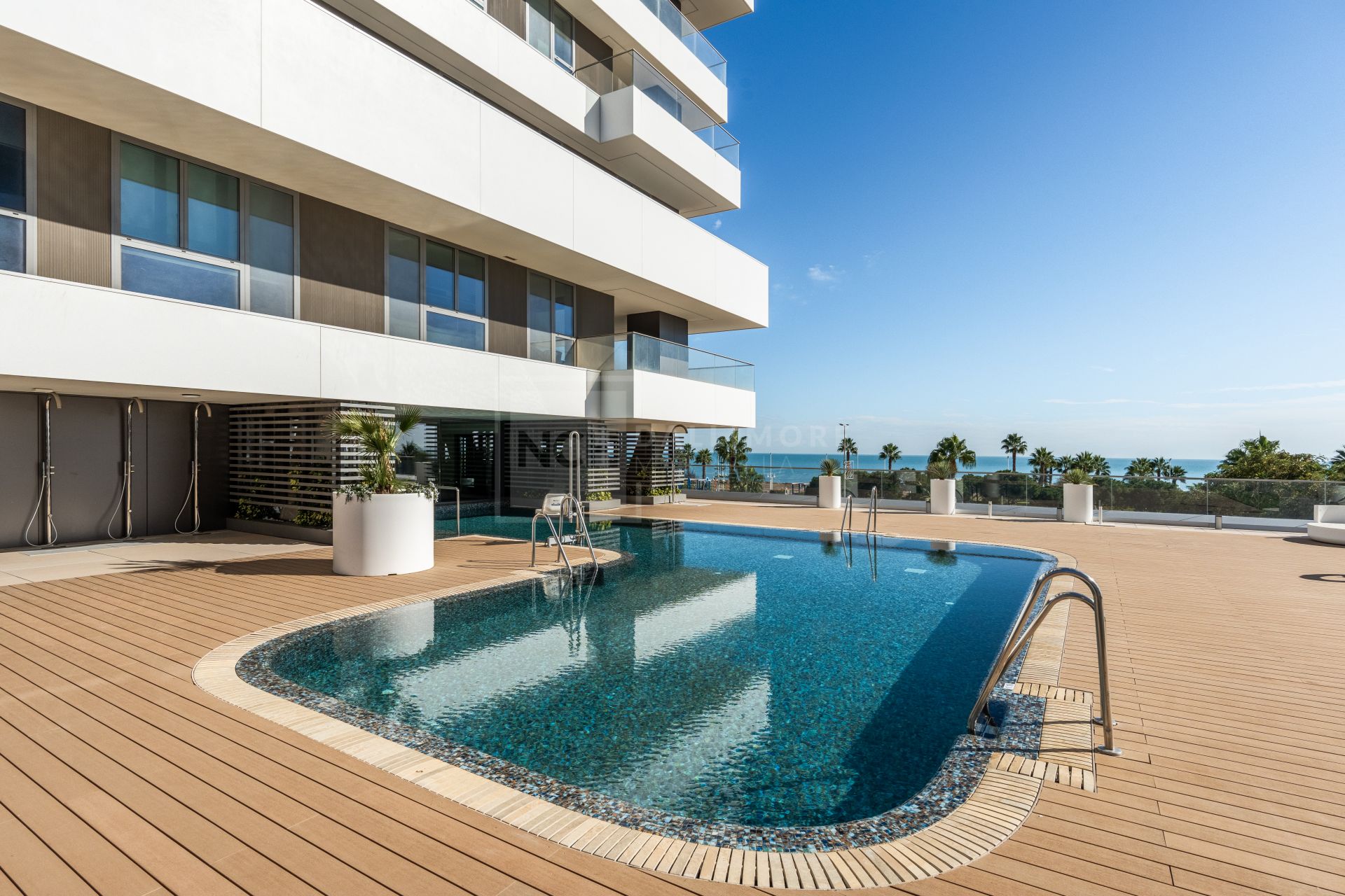 BEACHFRONT 4-BEDROOM APARTMENT WITH TERRACE, SPA, POOLS, AND CO-WORKING AREA