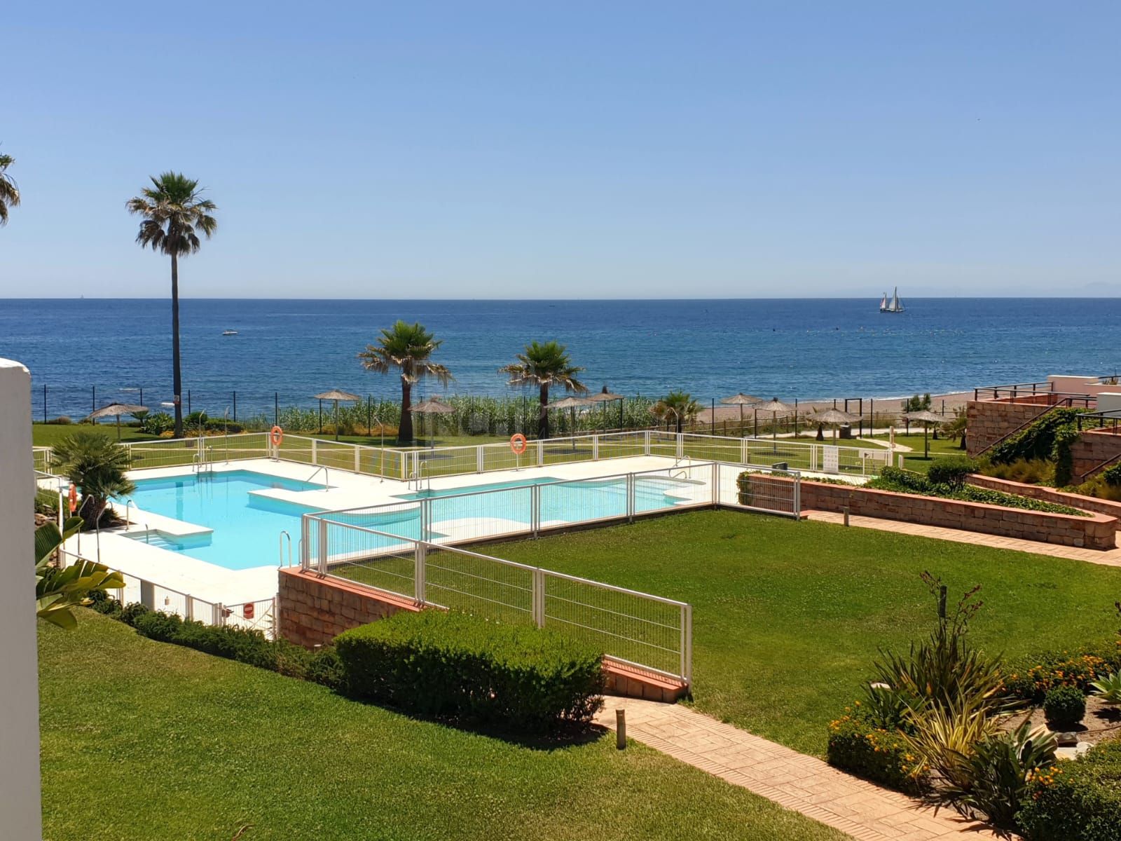 Exclusive South-Facing Beachfront Townhouse with Panoramic Sea Views