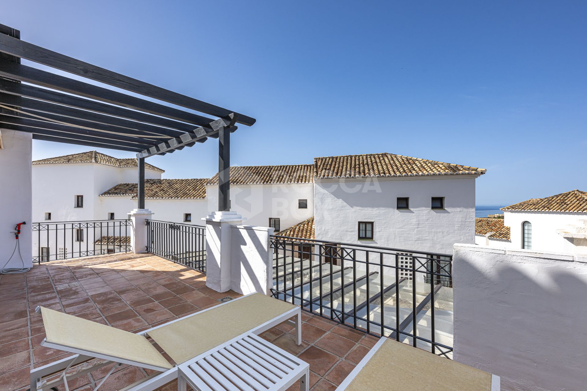 Mediterranean style south-facing triplex located in a gated community in Altos de Los Monteros, East Marbella