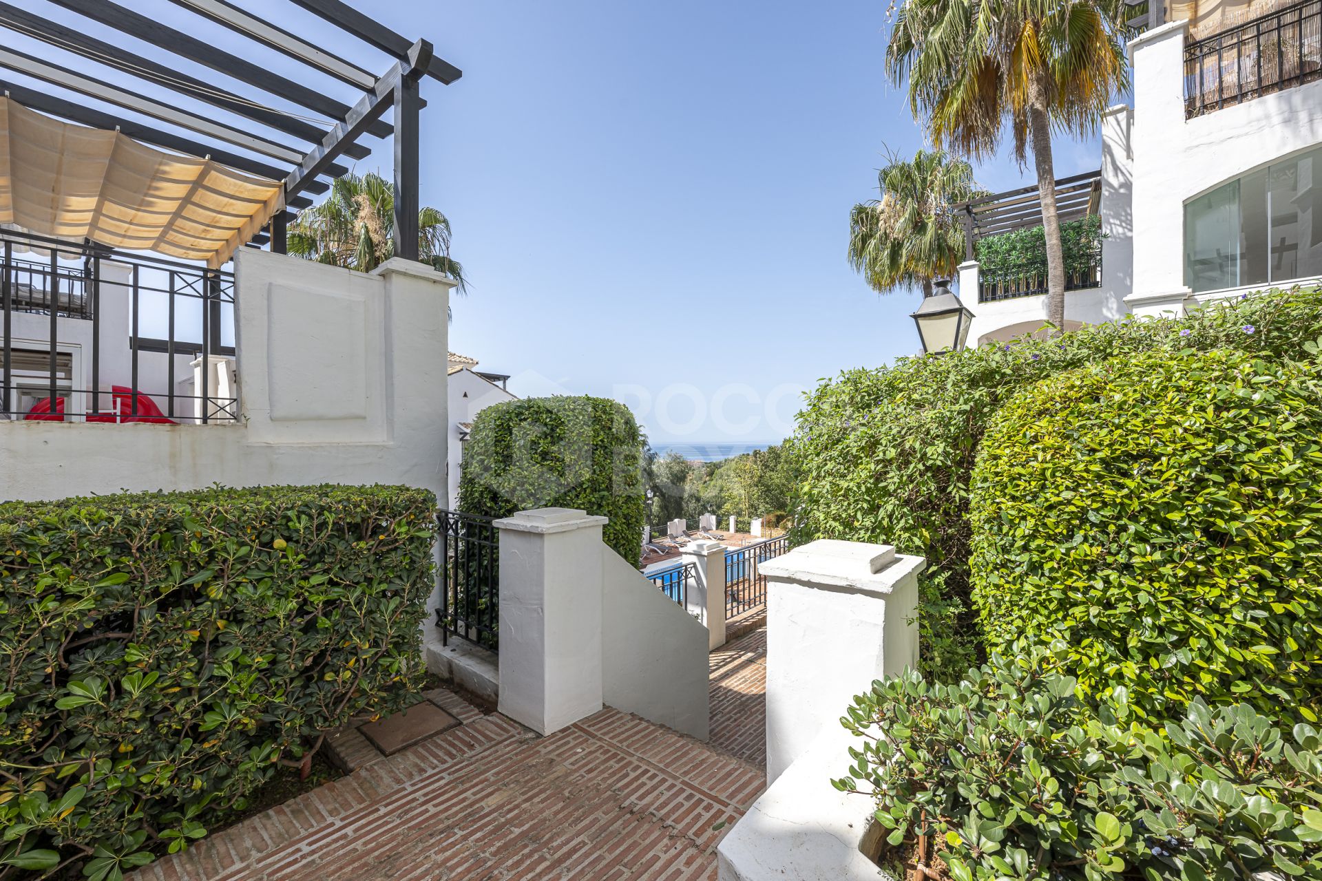 Mediterranean style south-facing triplex located in a gated community in Altos de Los Monteros, East Marbella