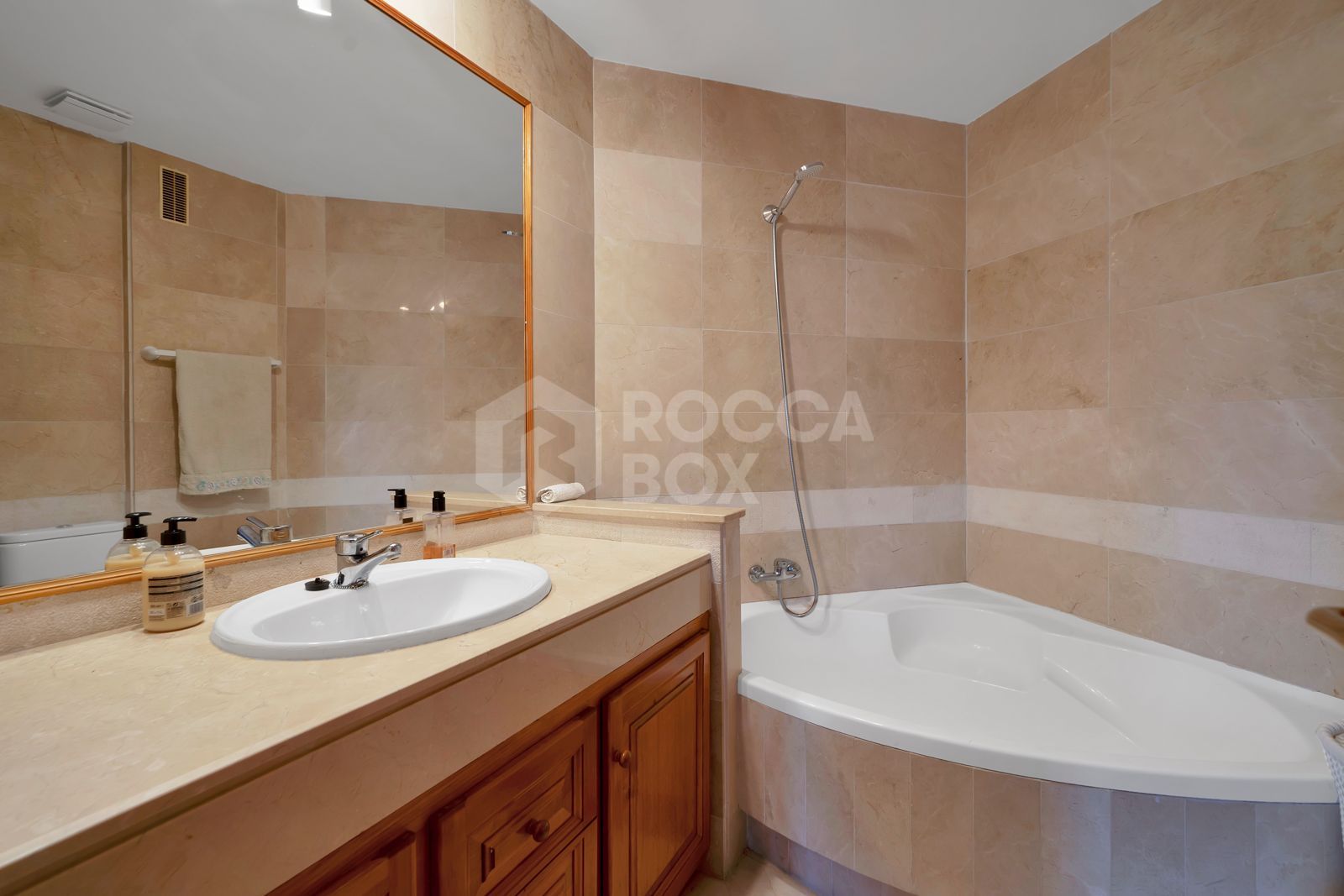 Recently renovated, west-facing middle-floor apartment within the exclusive gated community