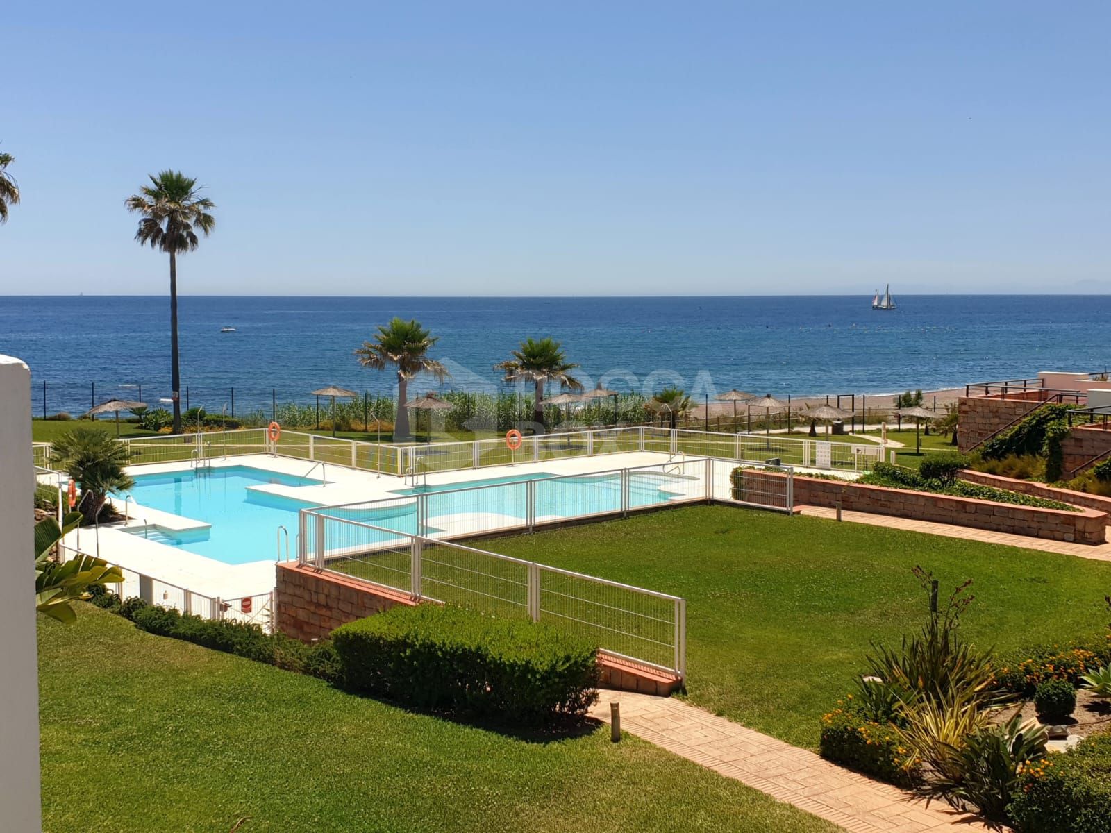 Exclusive South-Facing Beachfront Townhouse with Panoramic Sea Views