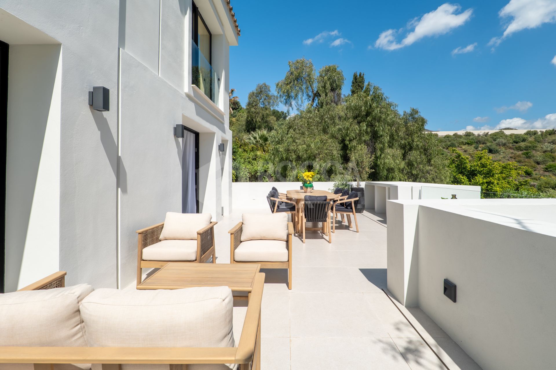 Welcome to Villa Lucalle, a contemporary masterpiece located in the picturesque grounds of Los Naranjos Hill Club in La Cerquilla, Nueva Andalucía.