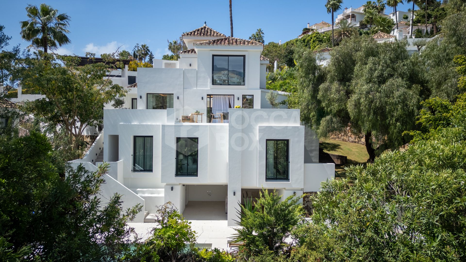 Welcome to Villa Lucalle, a contemporary masterpiece located in the picturesque grounds of Los Naranjos Hill Club in La Cerquilla, Nueva Andalucía.