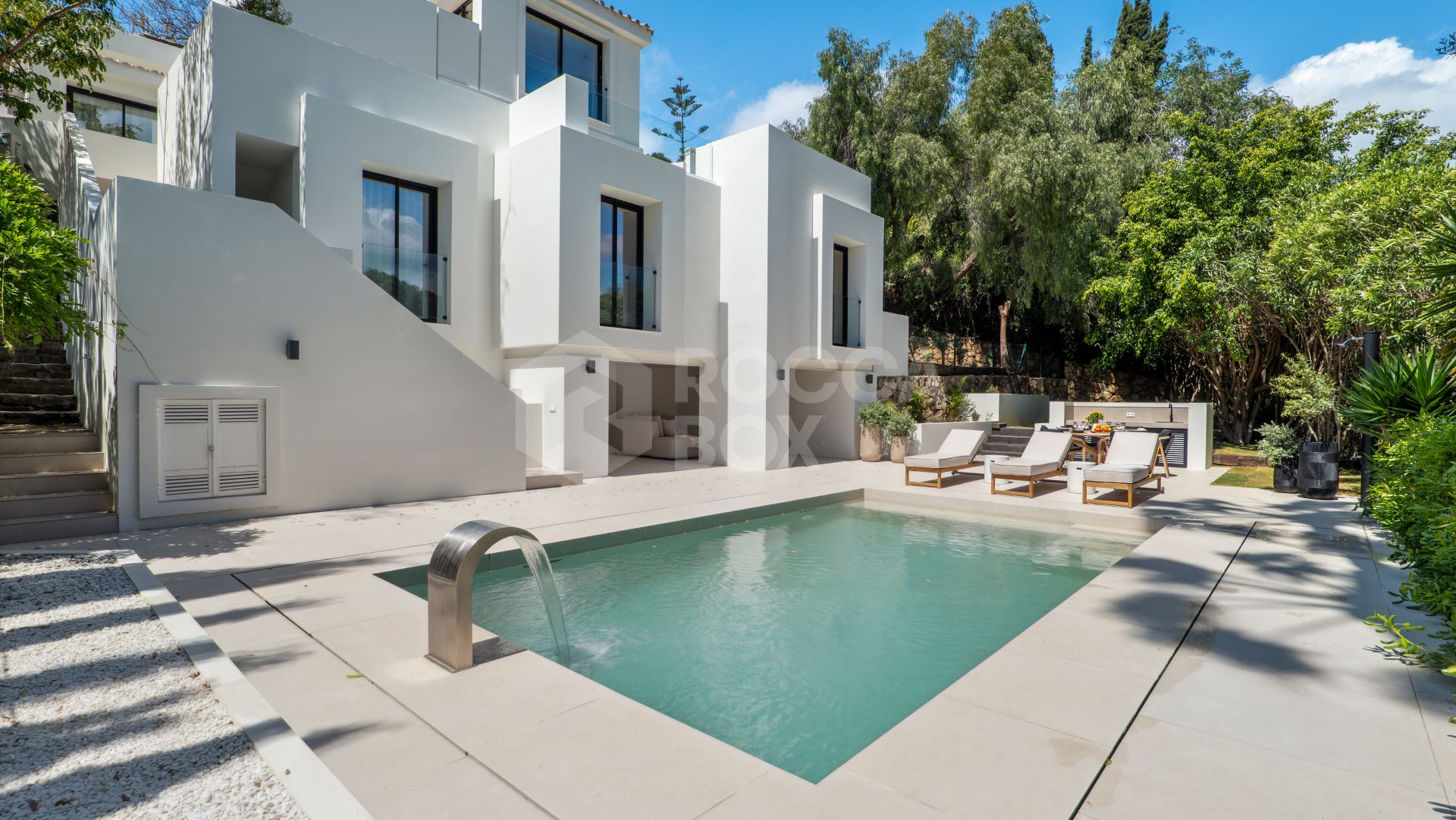 Welcome to Villa Lucalle, a contemporary masterpiece located in the picturesque grounds of Los Naranjos Hill Club in La Cerquilla, Nueva Andalucía.