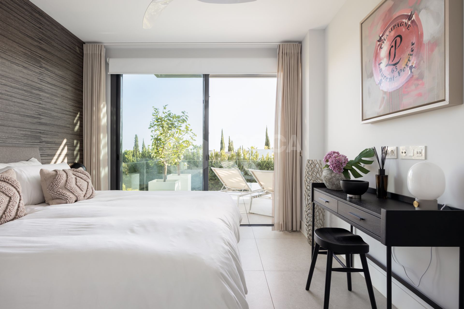 Elegant 2-bed, 2-bath apartment in Marbella’s Golf Valley with 112m² interior, 43m² terrace, luxury finishes, pools, gym, concierge & 2 parking spaces.