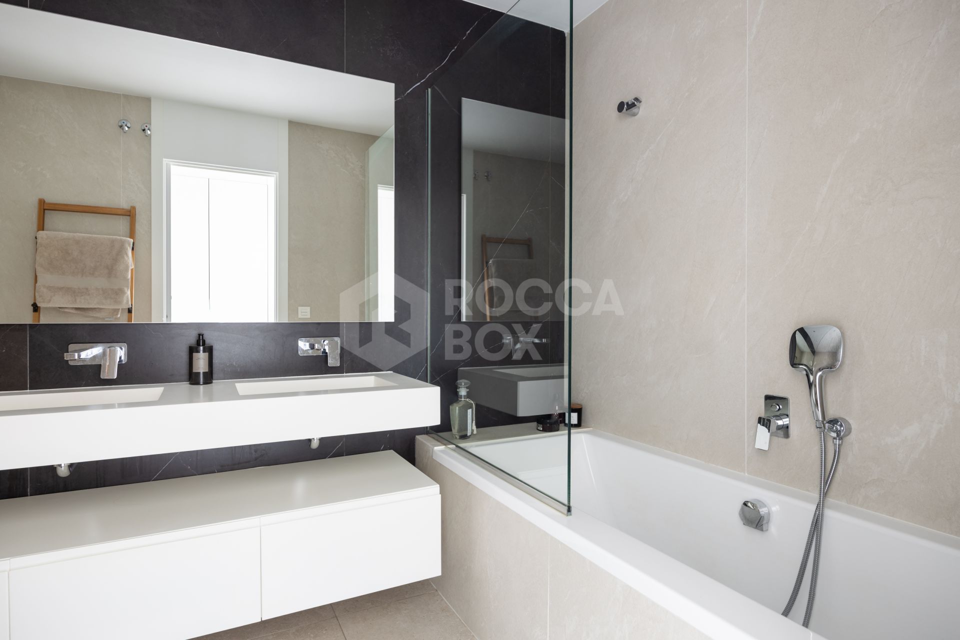 Elegant 2-bed, 2-bath apartment in Marbella’s Golf Valley with 112m² interior, 43m² terrace, luxury finishes, pools, gym, concierge & 2 parking spaces.