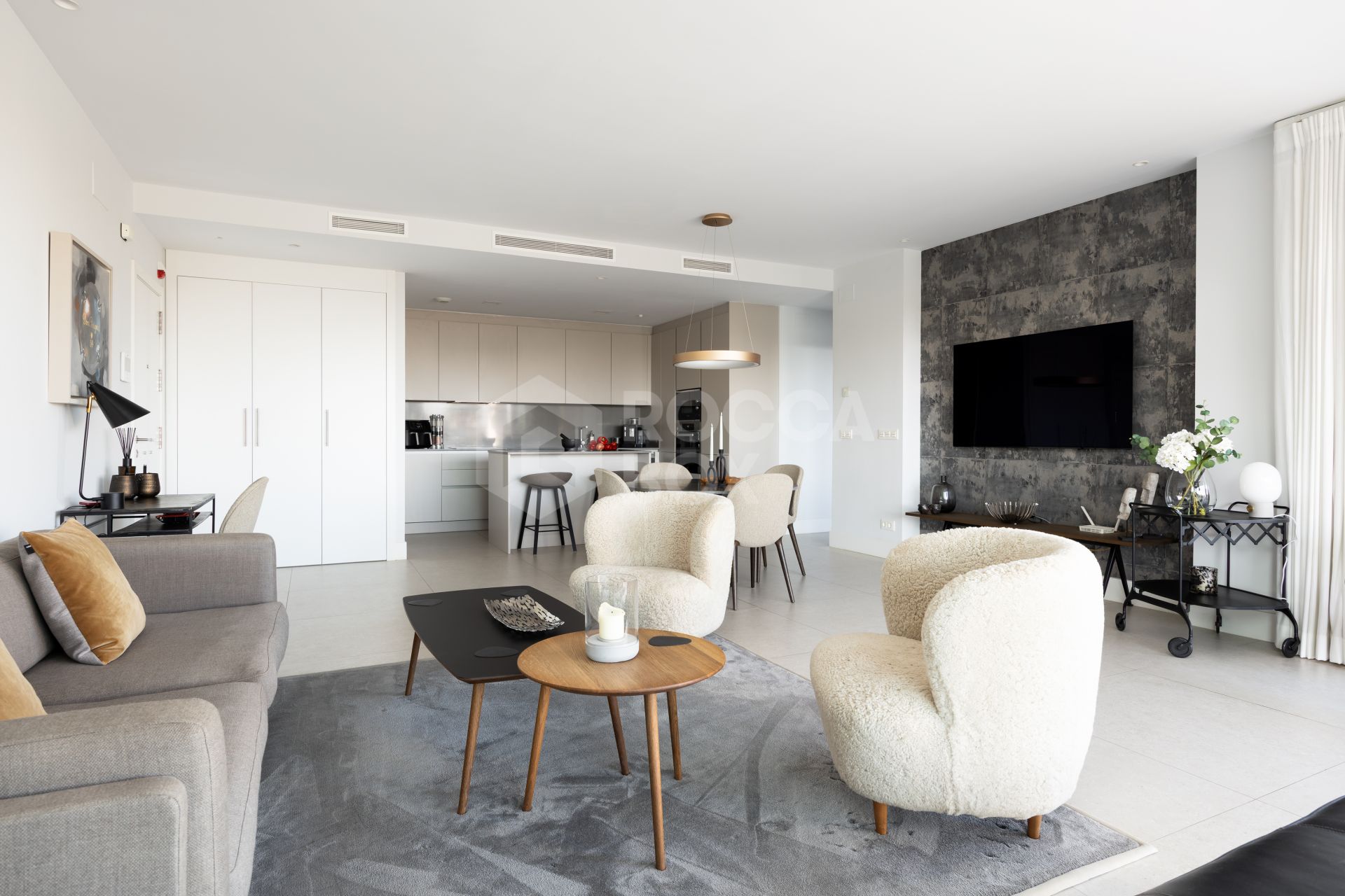 Elegant 2-bed, 2-bath apartment in Marbella’s Golf Valley with 112m² interior, 43m² terrace, luxury finishes, pools, gym, concierge & 2 parking spaces.