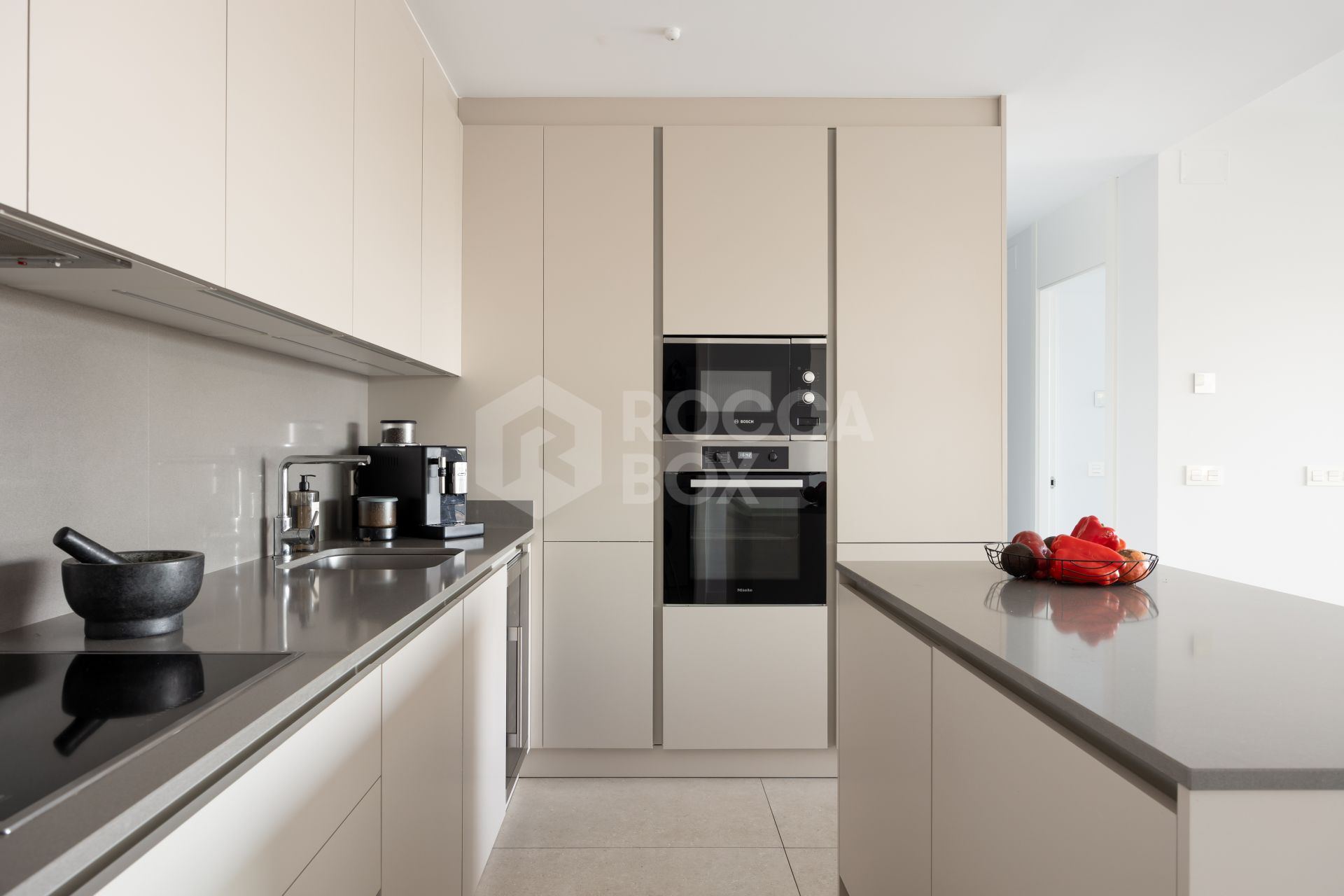 Elegant 2-bed, 2-bath apartment in Marbella’s Golf Valley with 112m² interior, 43m² terrace, luxury finishes, pools, gym, concierge & 2 parking spaces.