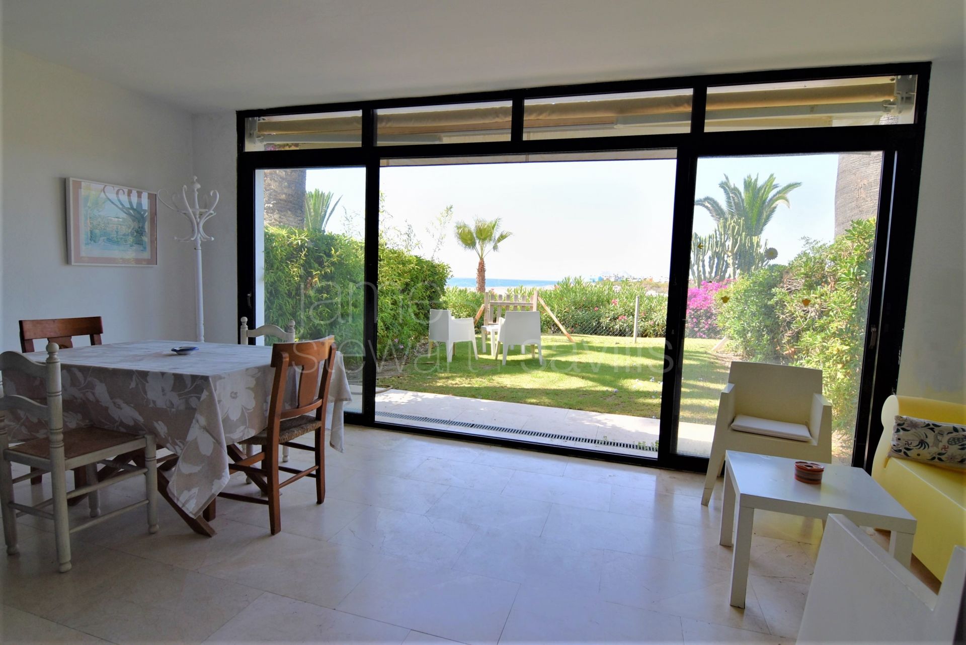 Casa pareada en primera linea del rio/mar en la playa de Sotogrande