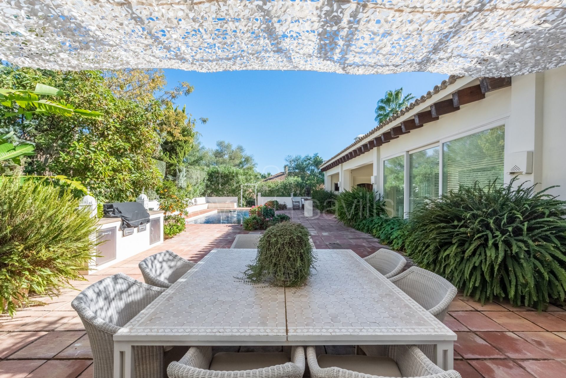 A very stylish house set in a beautiful garden in the Kings and Queens area of Sotogrande Costa