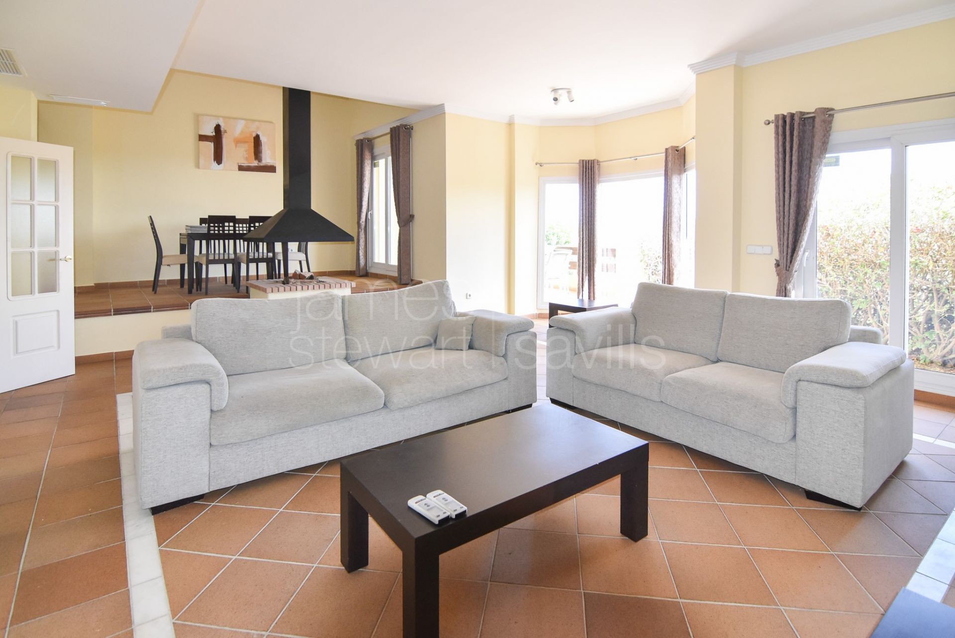 Three-Storey Townhouse with Solarium, Sea Views, and Versatile Basement Space in Hoyo 1, Pueblo Nuevo de Guadiaro.