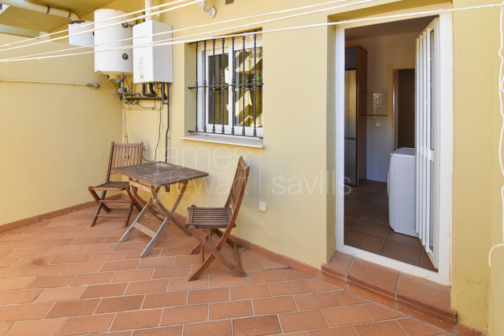 Three-Storey Townhouse with Solarium, Sea Views, and Versatile Basement Space in Hoyo 1, Pueblo Nuevo de Guadiaro.