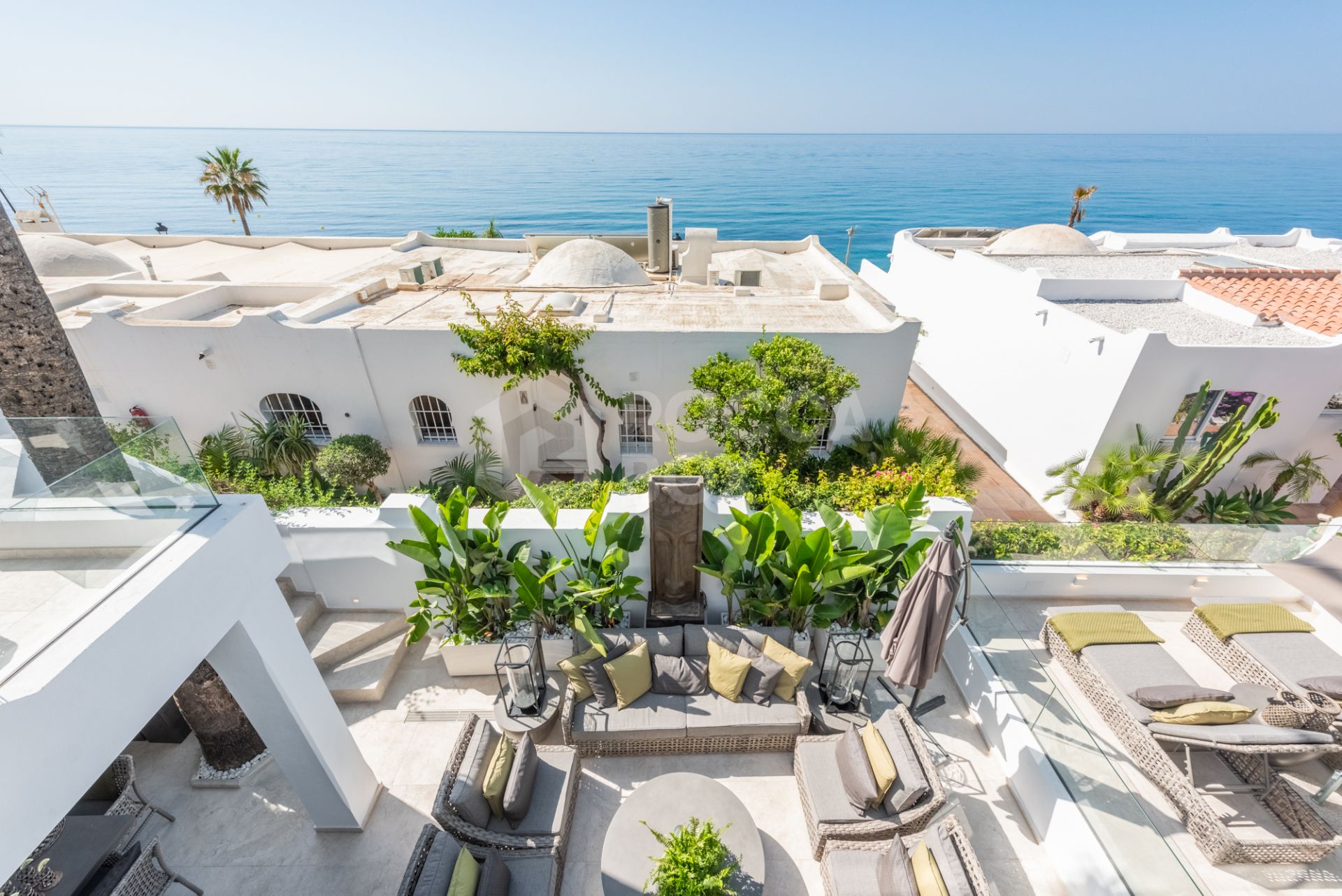 Scandi-style design bungalow in the beachfront Oasis Club on Marbella's Golden Mile.