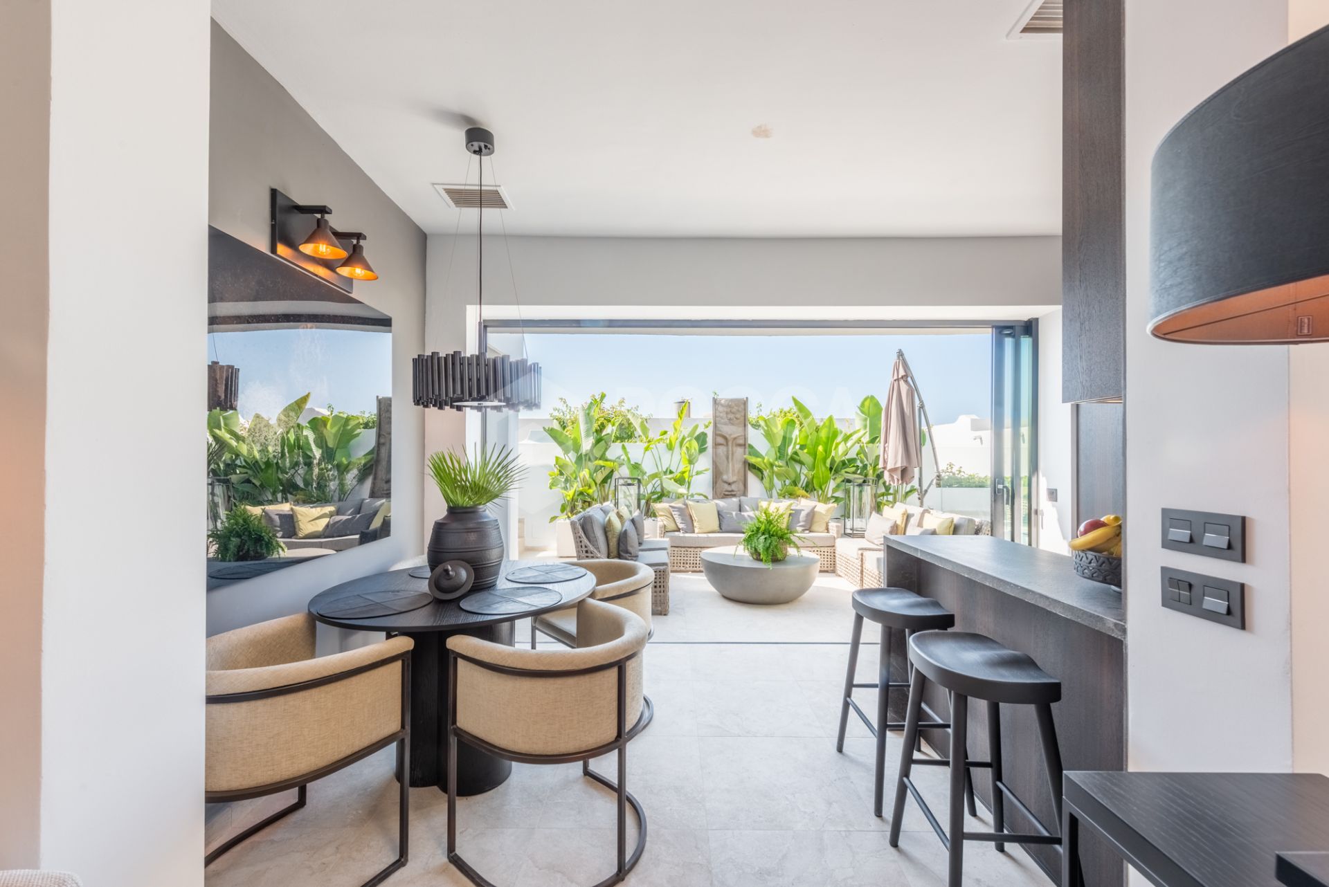 Scandi-style design bungalow in the beachfront Oasis Club on Marbella's Golden Mile.