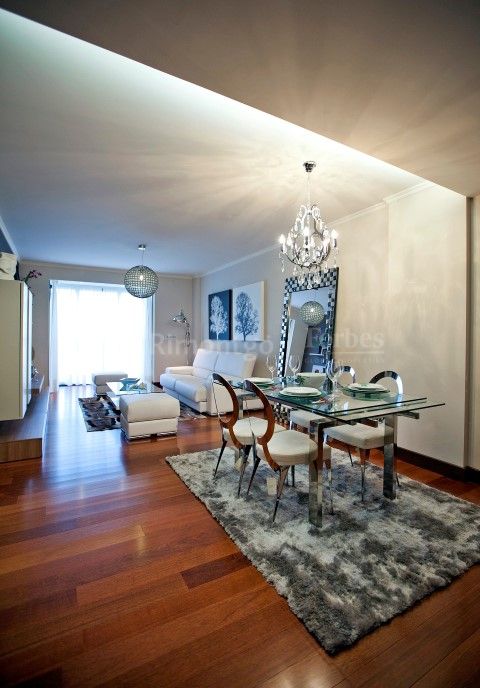 Luxuriously appointed four bedroom apartment for sale on the ground floor of the exclusive 'Citania' complex, located just a short walk from the bay of Riazor, public transport links and other local services in A Coruña, Spain.