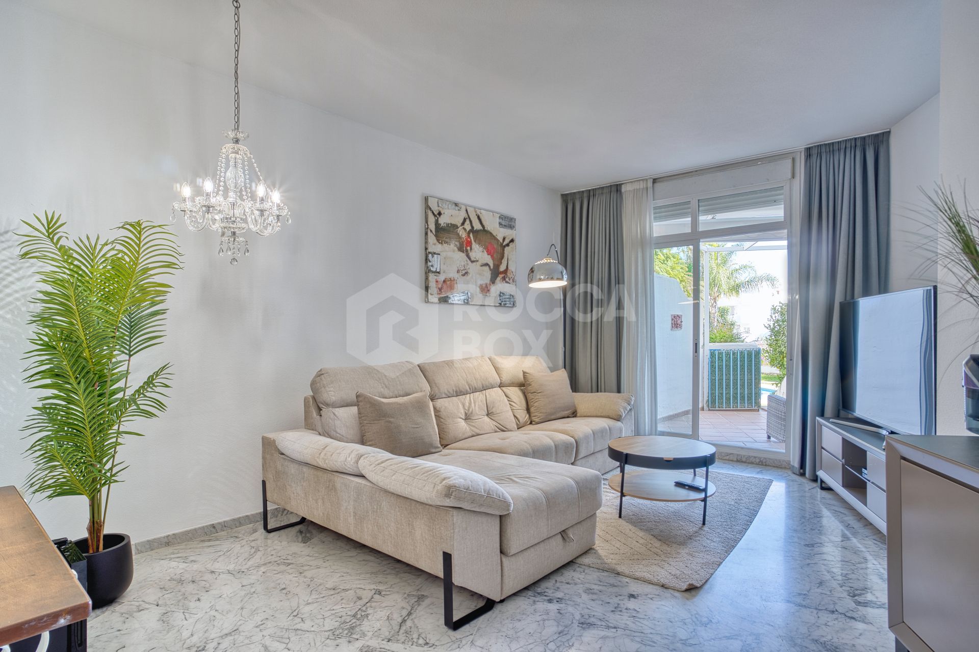 Fully renovated two bedroom, ground floor apartment in the well-known and gated community Marbella Real