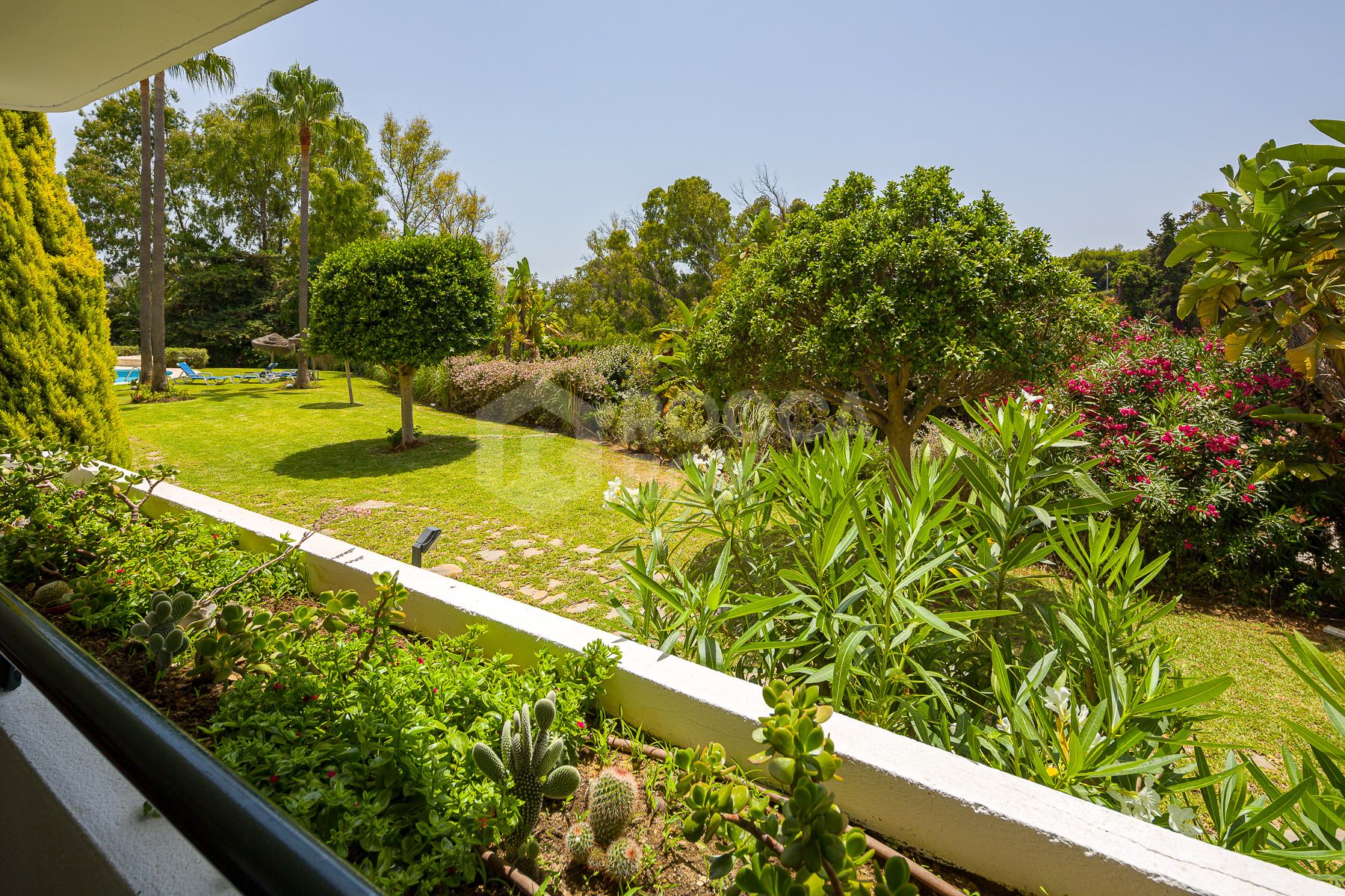 Stunning two bedroom south west facing elevated ground floor apartment in the heart of Marbella's Golden Mile