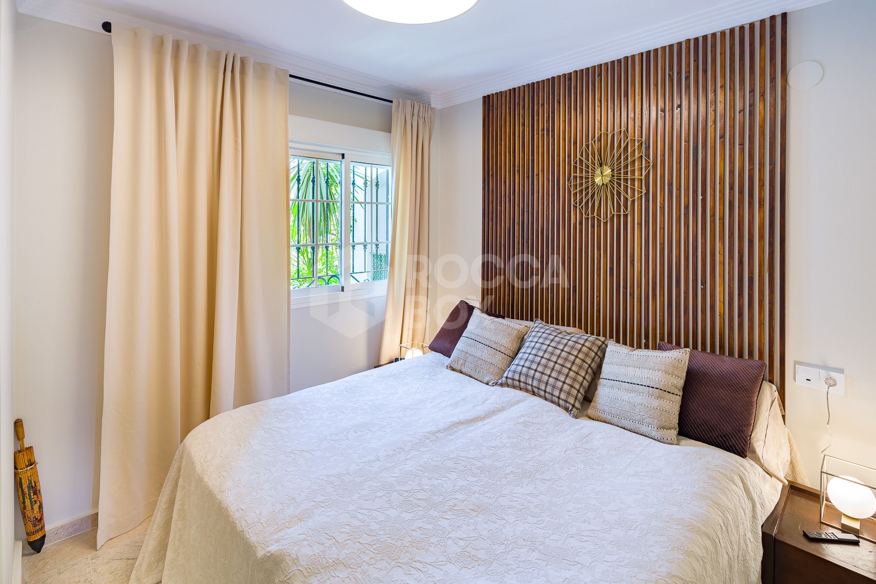 Stunning two bedroom south west facing elevated ground floor apartment in the heart of Marbella's Golden Mile