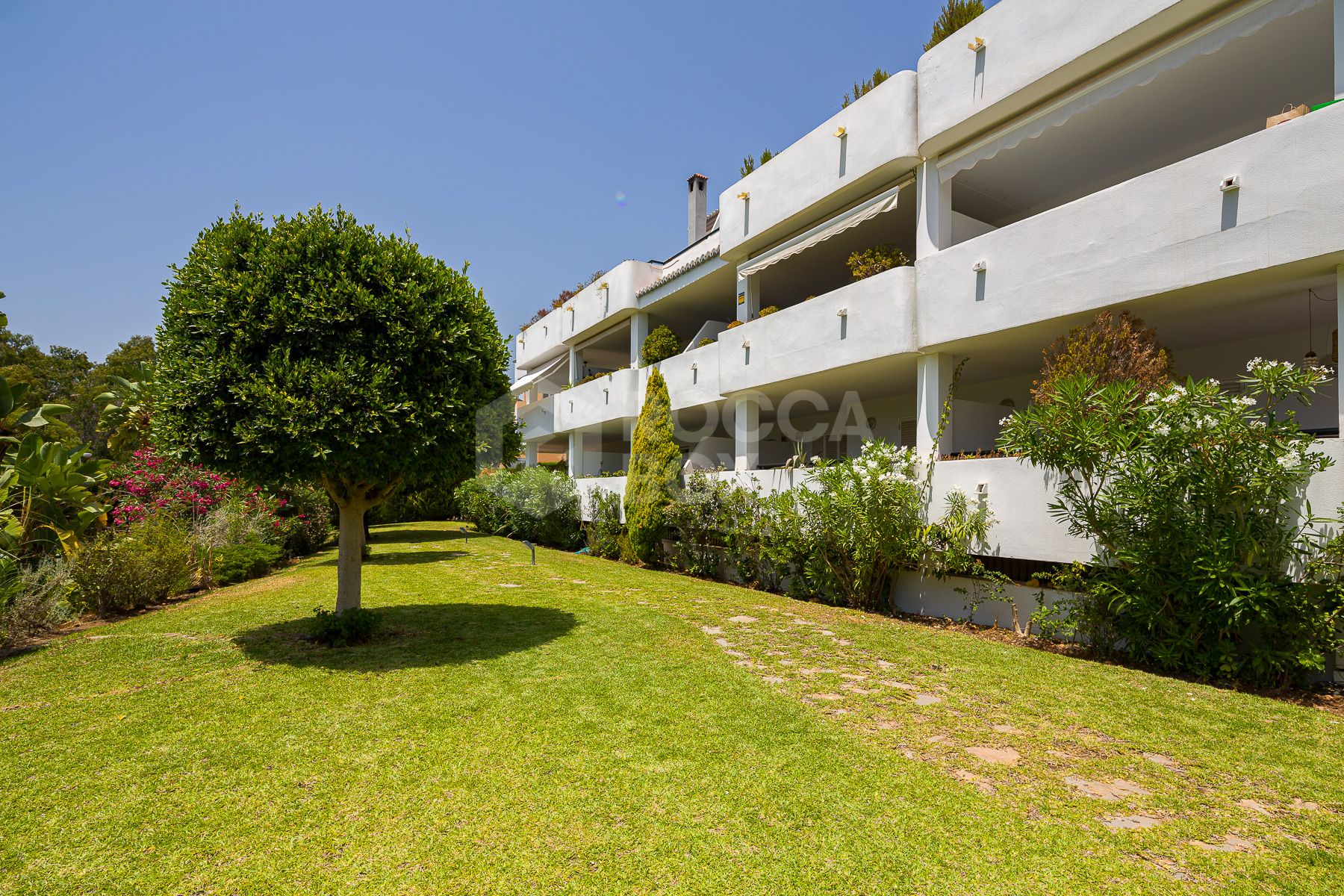 Stunning two bedroom south west facing elevated ground floor apartment in the heart of Marbella's Golden Mile