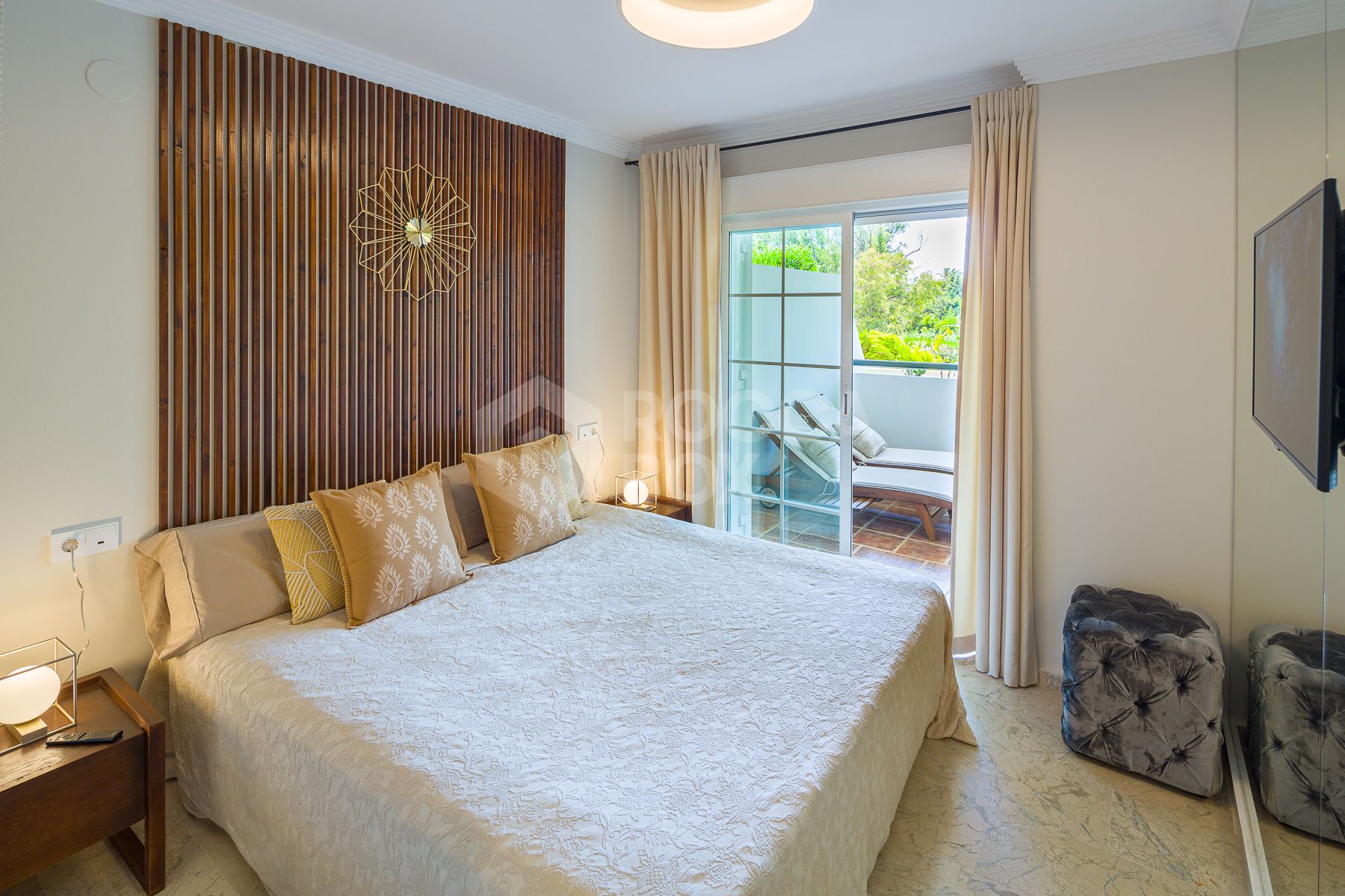 Stunning two bedroom south west facing elevated ground floor apartment in the heart of Marbella's Golden Mile