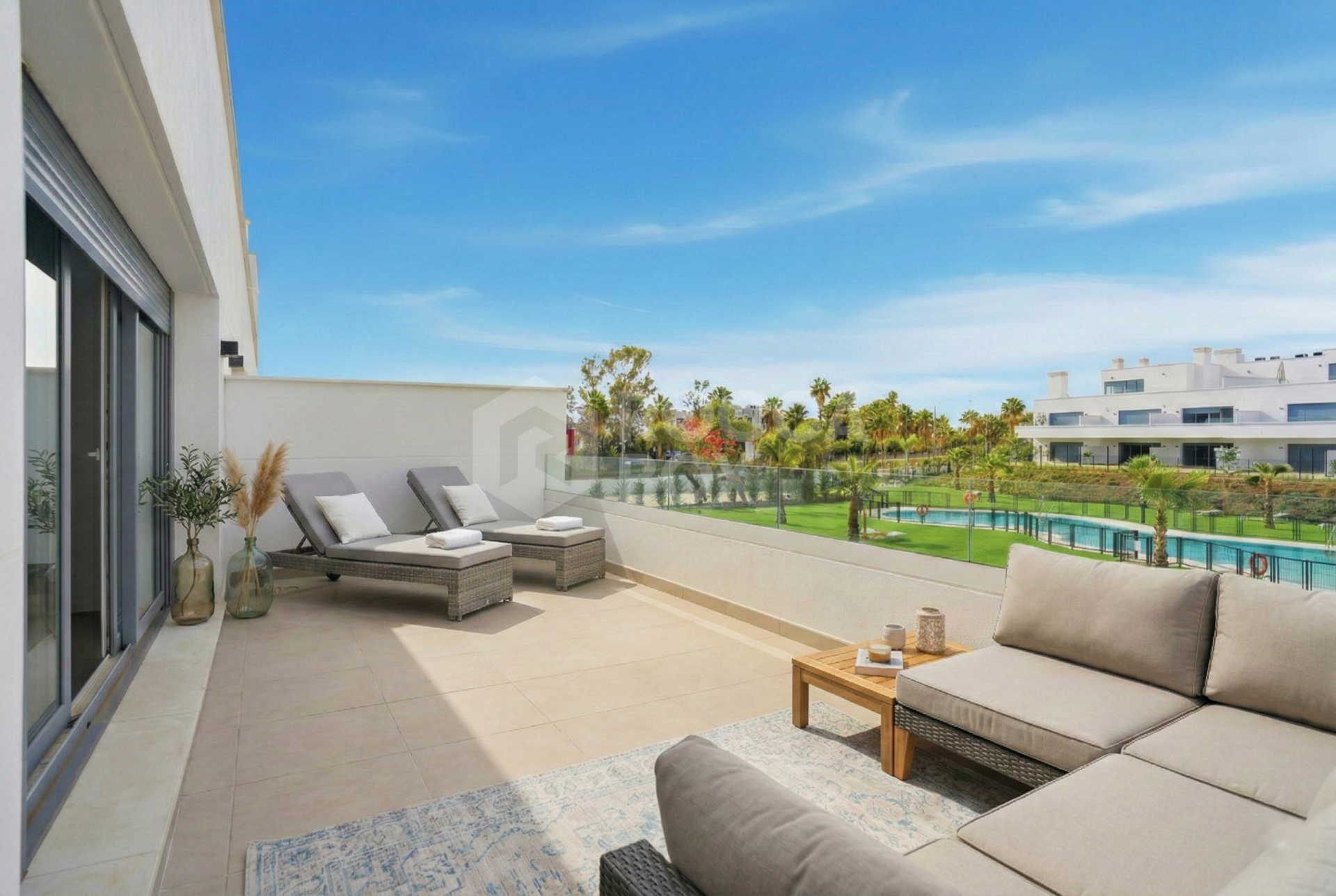 Stylish, southwest facing two bedroom apartment located in the sought-after gated community Acqua Gardens on the New Golden Mile, Estepona