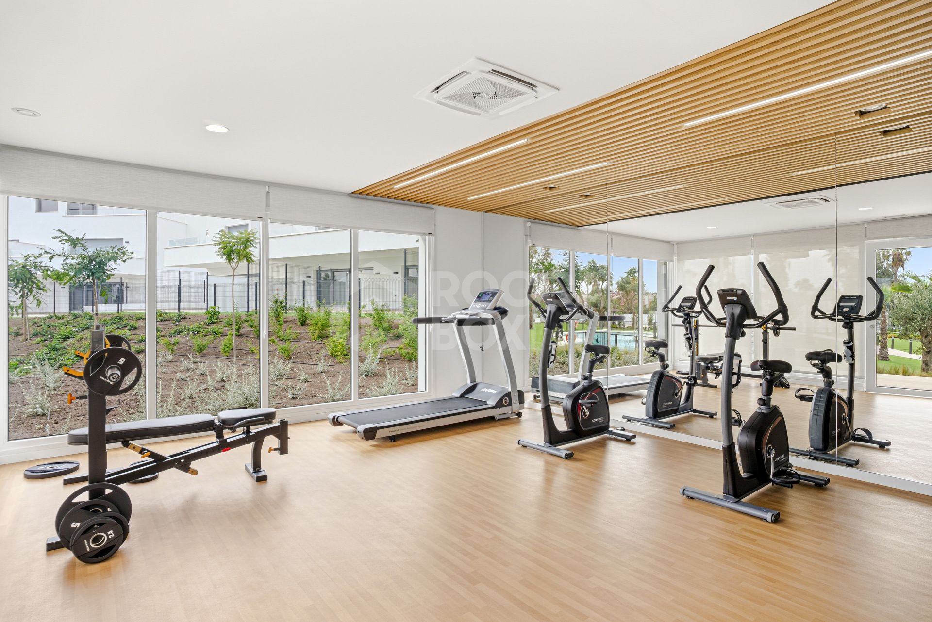 Stylish, southwest facing two bedroom apartment located in the sought-after gated community Acqua Gardens on the New Golden Mile, Estepona