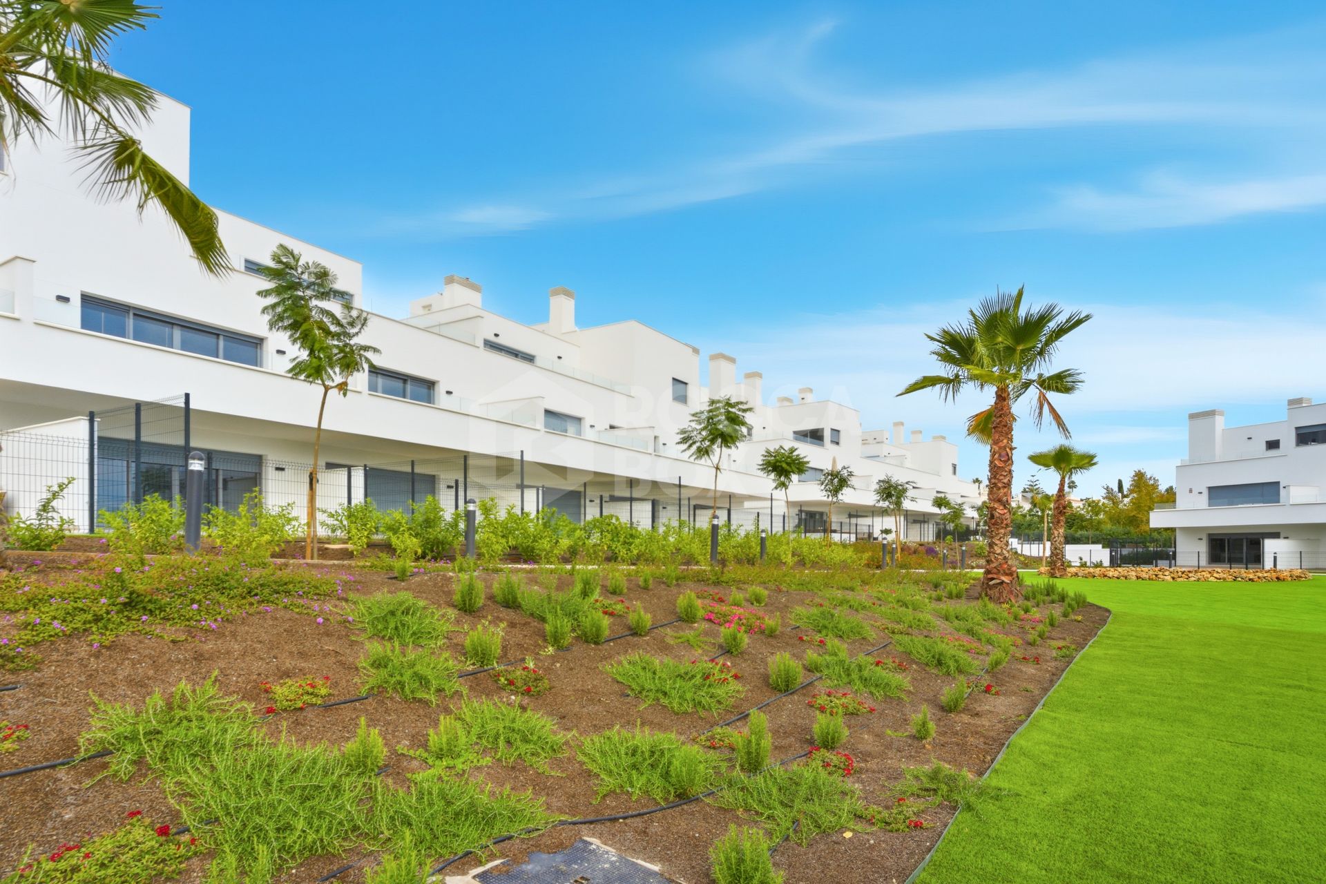 Stylish, southwest facing two bedroom apartment located in the sought-after gated community Acqua Gardens on the New Golden Mile, Estepona