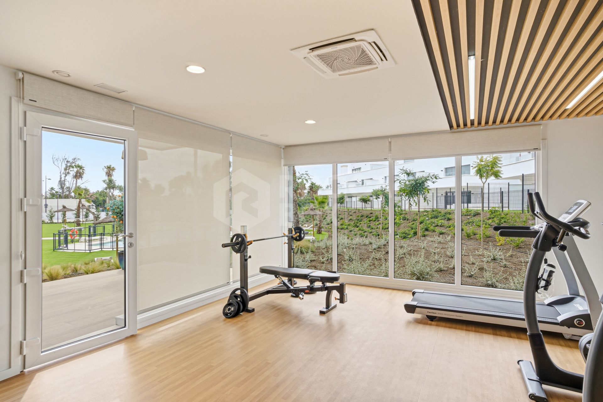 Stylish, southwest facing two bedroom apartment located in the sought-after gated community Acqua Gardens on the New Golden Mile, Estepona