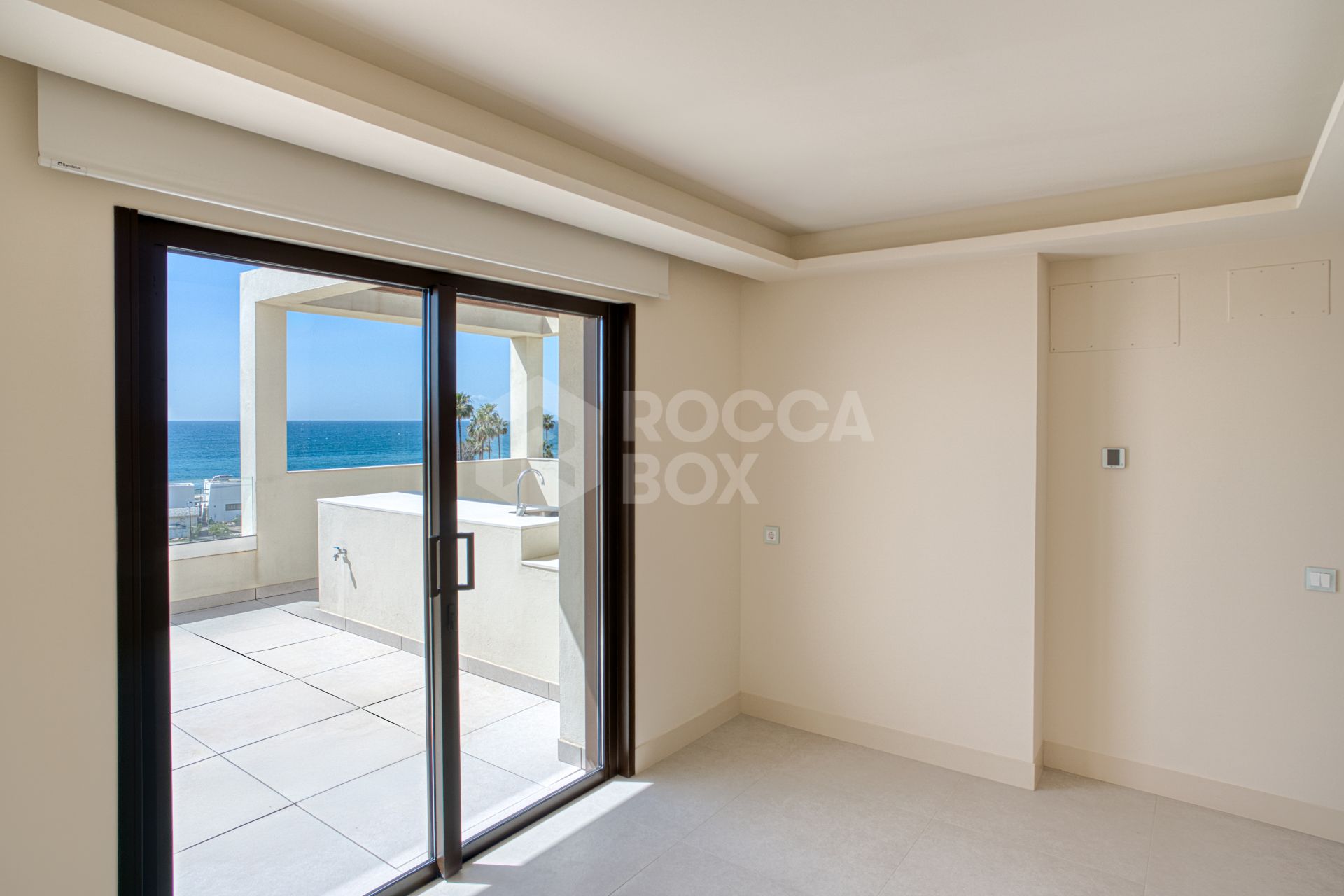 Luxurious south-facing four-bedroom duplex penthouse, frontline beach, located in a beachfront community on Marbella’s prestigious New Golden Mile with sea views.