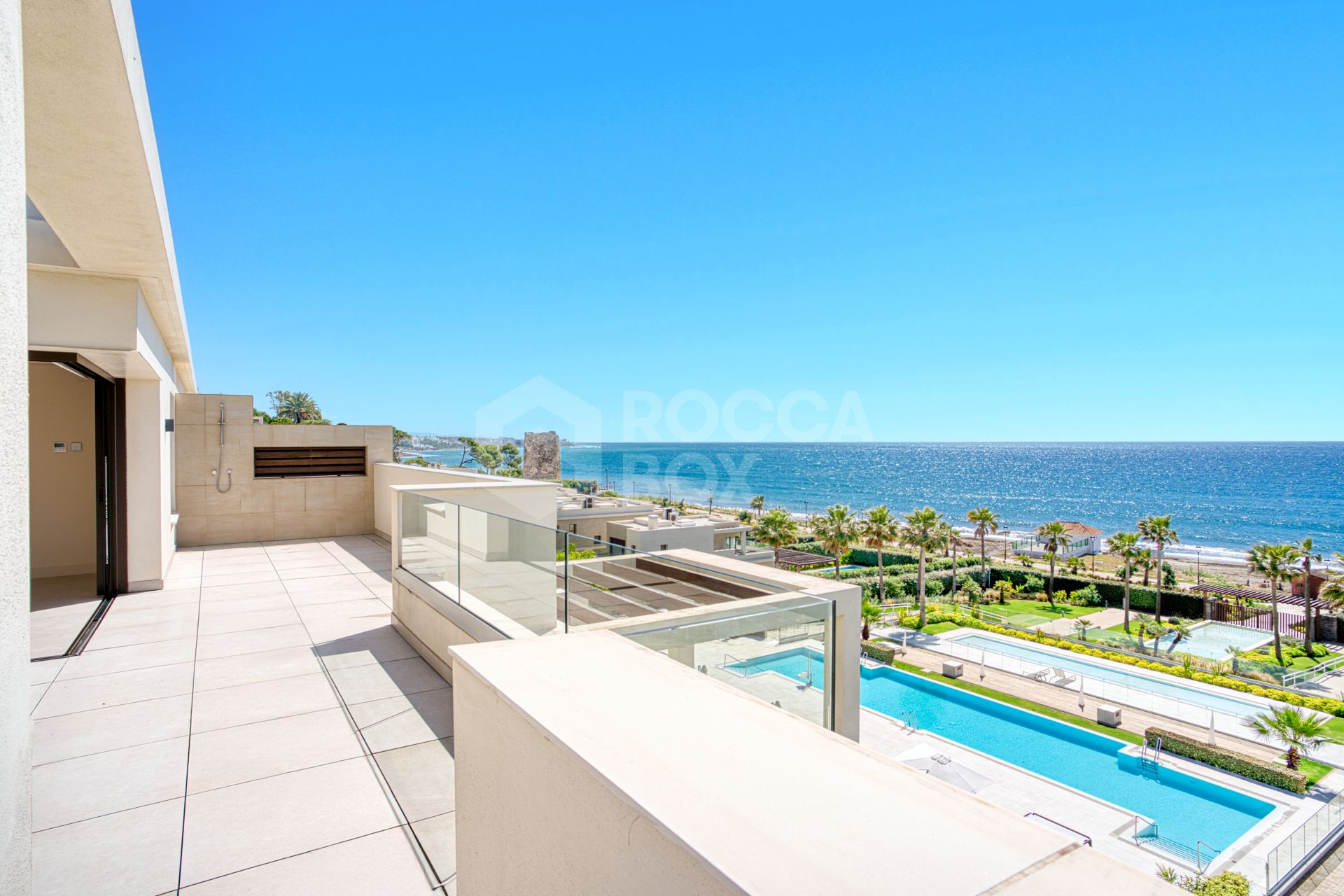 Luxurious south-facing four-bedroom duplex penthouse, frontline beach, located in a beachfront community on Marbella’s prestigious New Golden Mile with sea views.