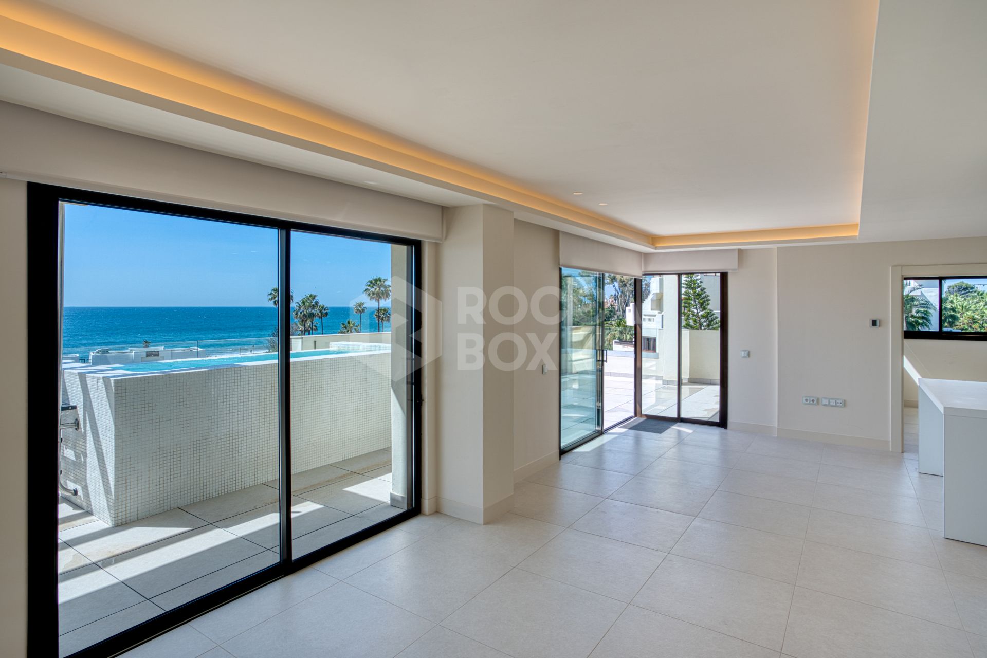 Luxurious south-facing four-bedroom duplex penthouse, frontline beach, located in a beachfront community on Marbella’s prestigious New Golden Mile with sea views.