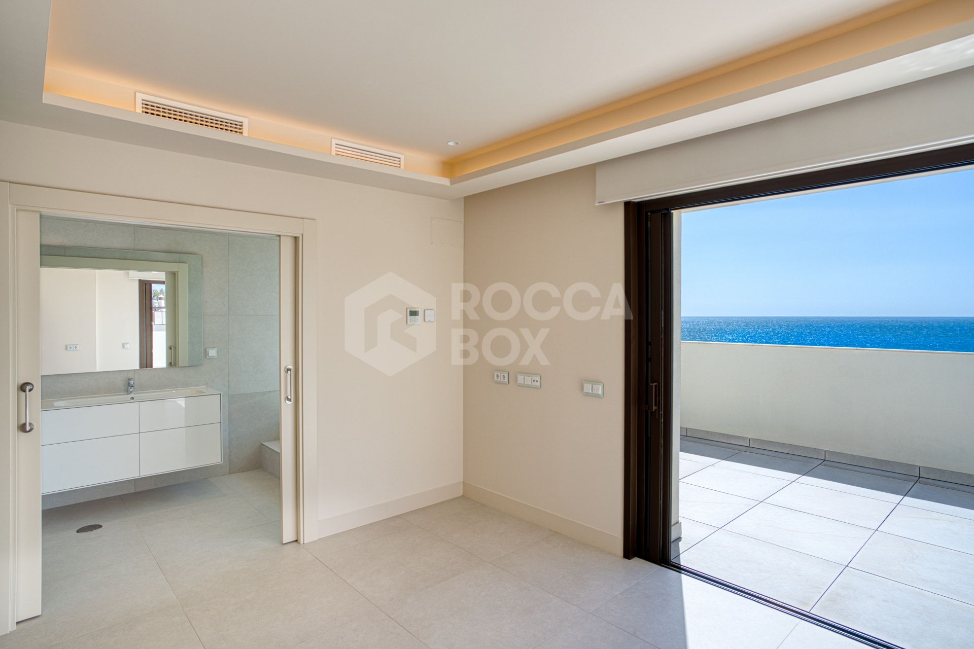 Luxurious south-facing four-bedroom duplex penthouse, frontline beach, located in a beachfront community on Marbella’s prestigious New Golden Mile with sea views.