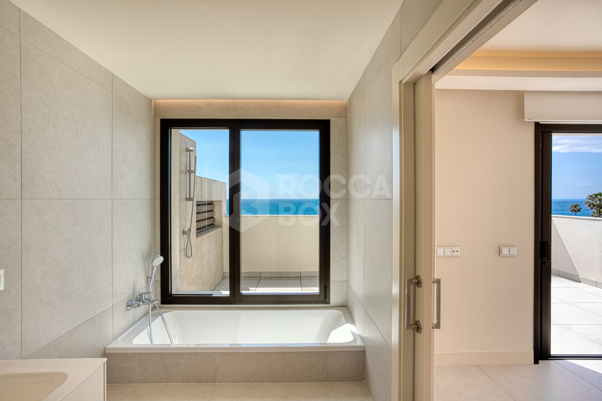 Luxurious south-facing four-bedroom duplex penthouse, frontline beach, located in a beachfront community on Marbella’s prestigious New Golden Mile with sea views.