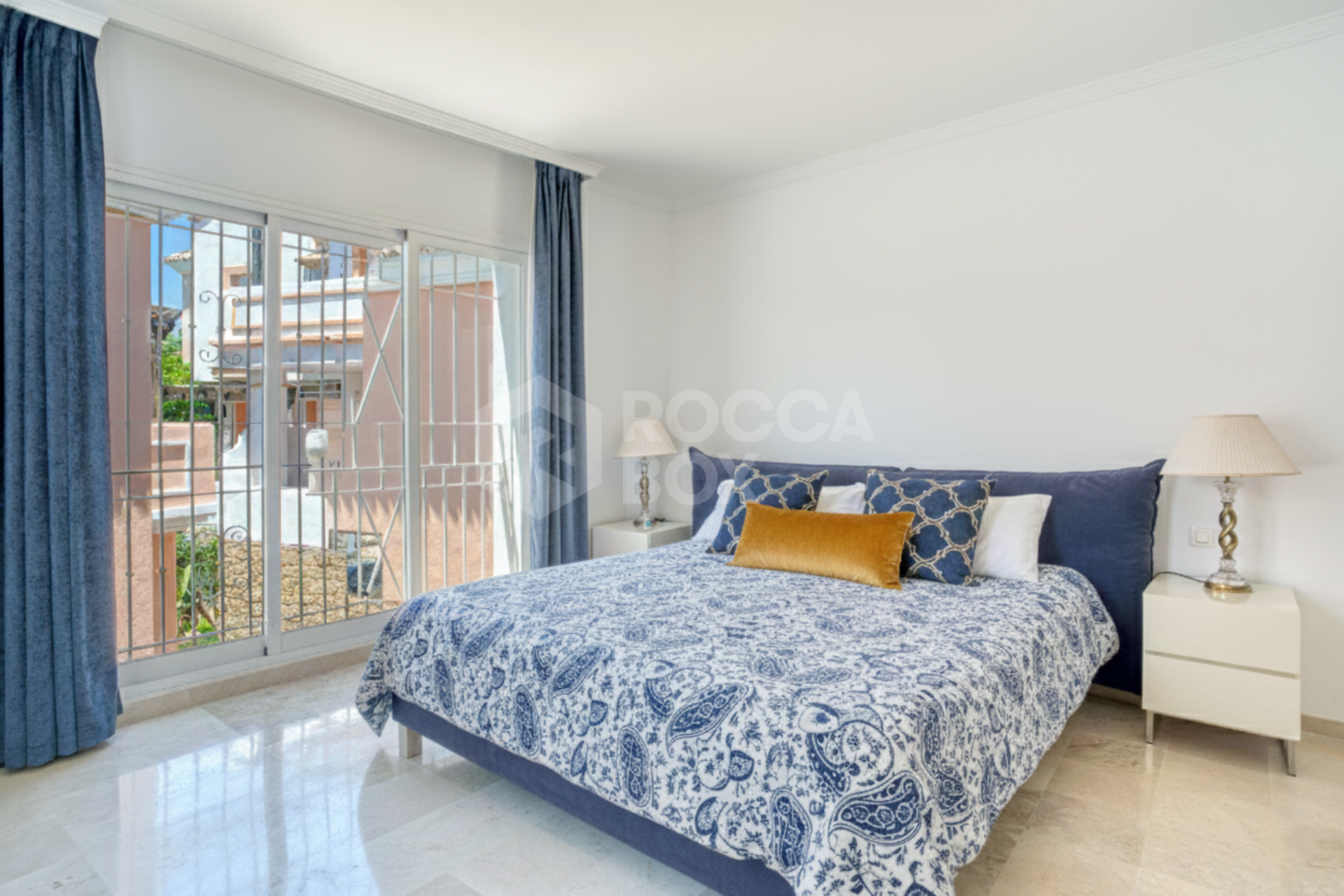 Elegant two bedroom, south west facing townhouse set within an exclusive gated community of Nueva Andalucia, Marbella