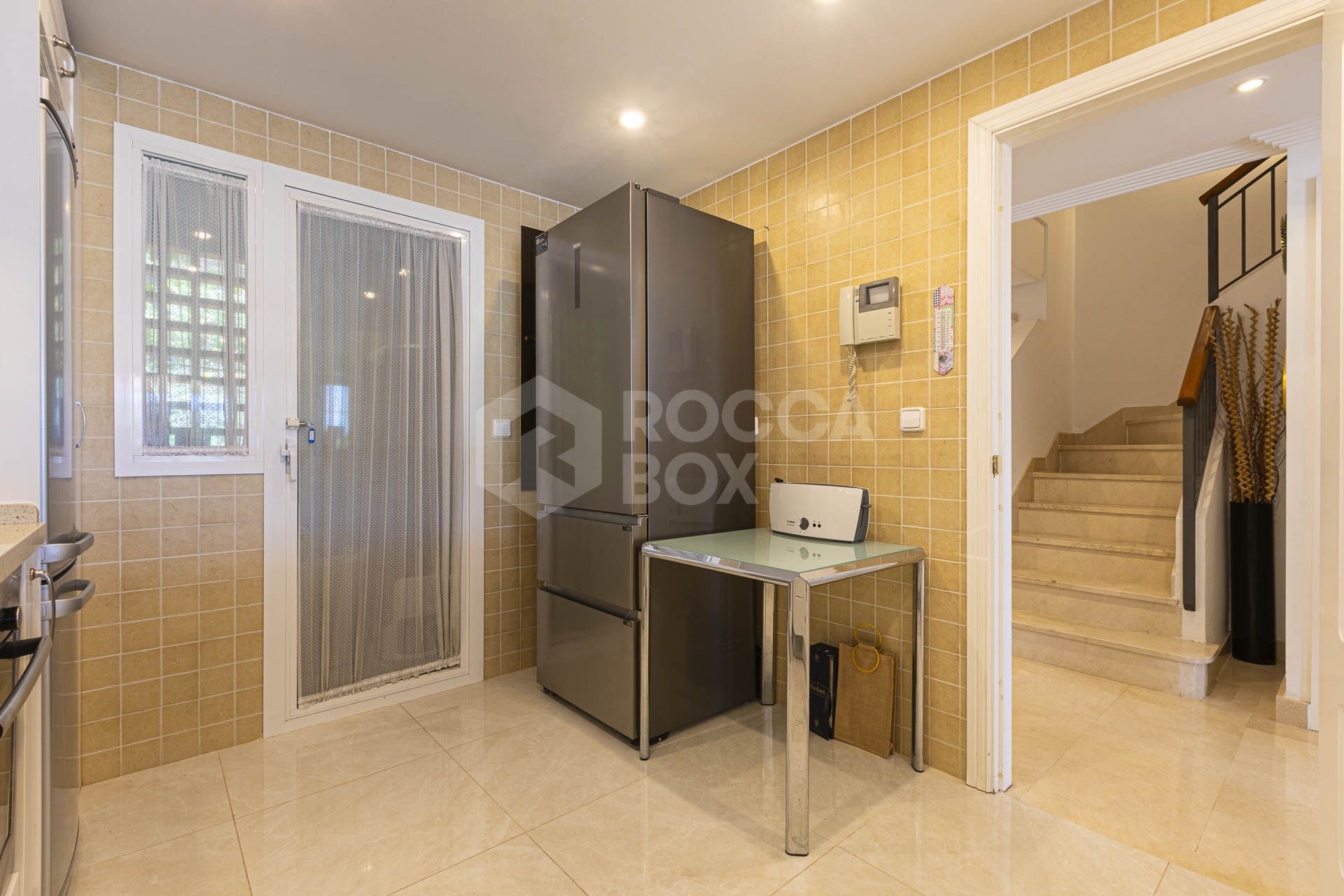Beautiful south-facing, four bedroom townhouse in Los Almendros, part of the secure Los Arqueros Golf community in Benahavís