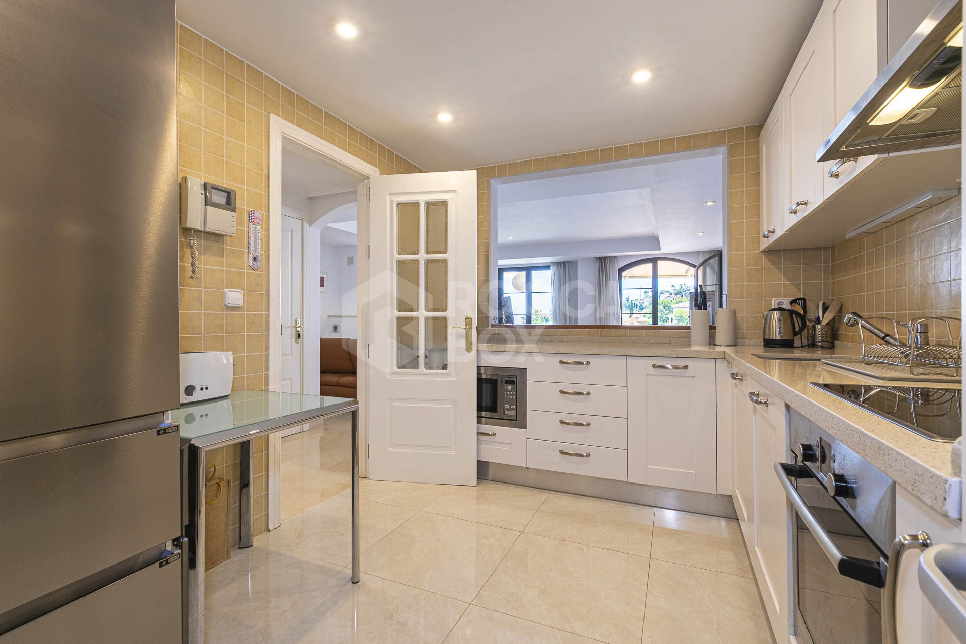 Beautiful south-facing, four bedroom townhouse in Los Almendros, part of the secure Los Arqueros Golf community in Benahavís