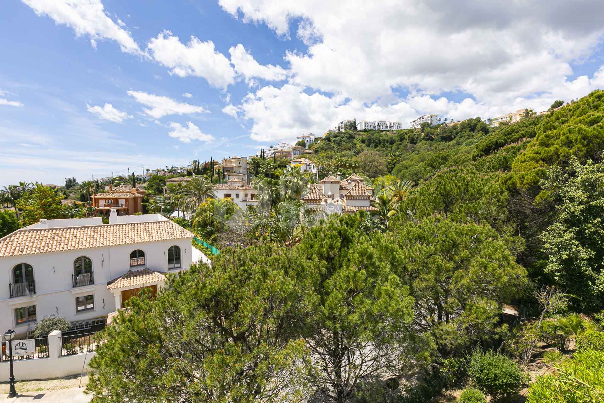 Beautiful south-facing, four bedroom townhouse in Los Almendros, part of the secure Los Arqueros Golf community in Benahavís