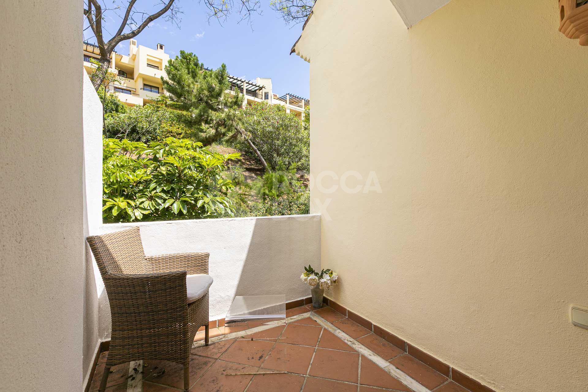 Beautiful south-facing, four bedroom townhouse in Los Almendros, part of the secure Los Arqueros Golf community in Benahavís
